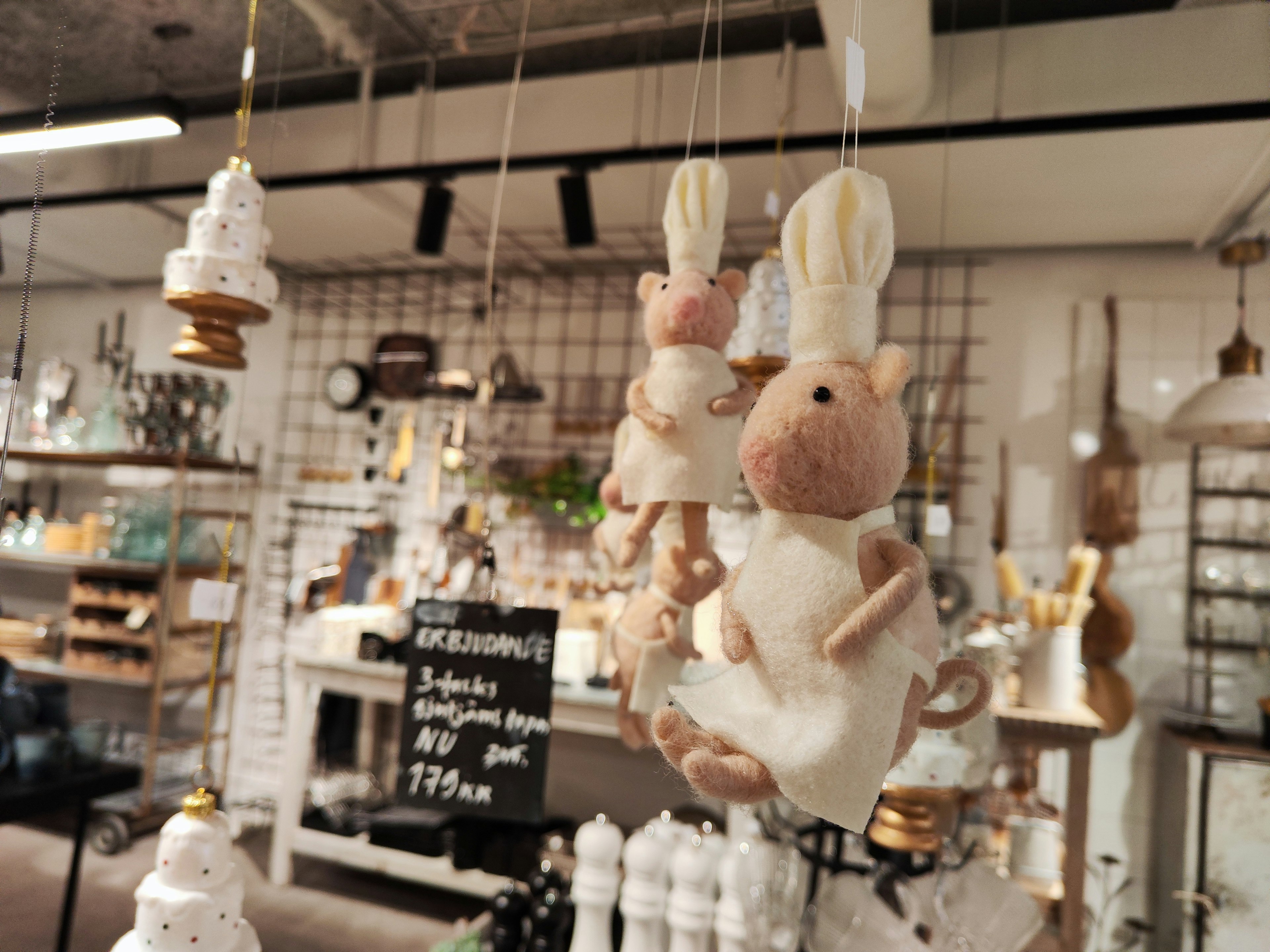 Cute chef rabbit figurines hanging as kitchen decor