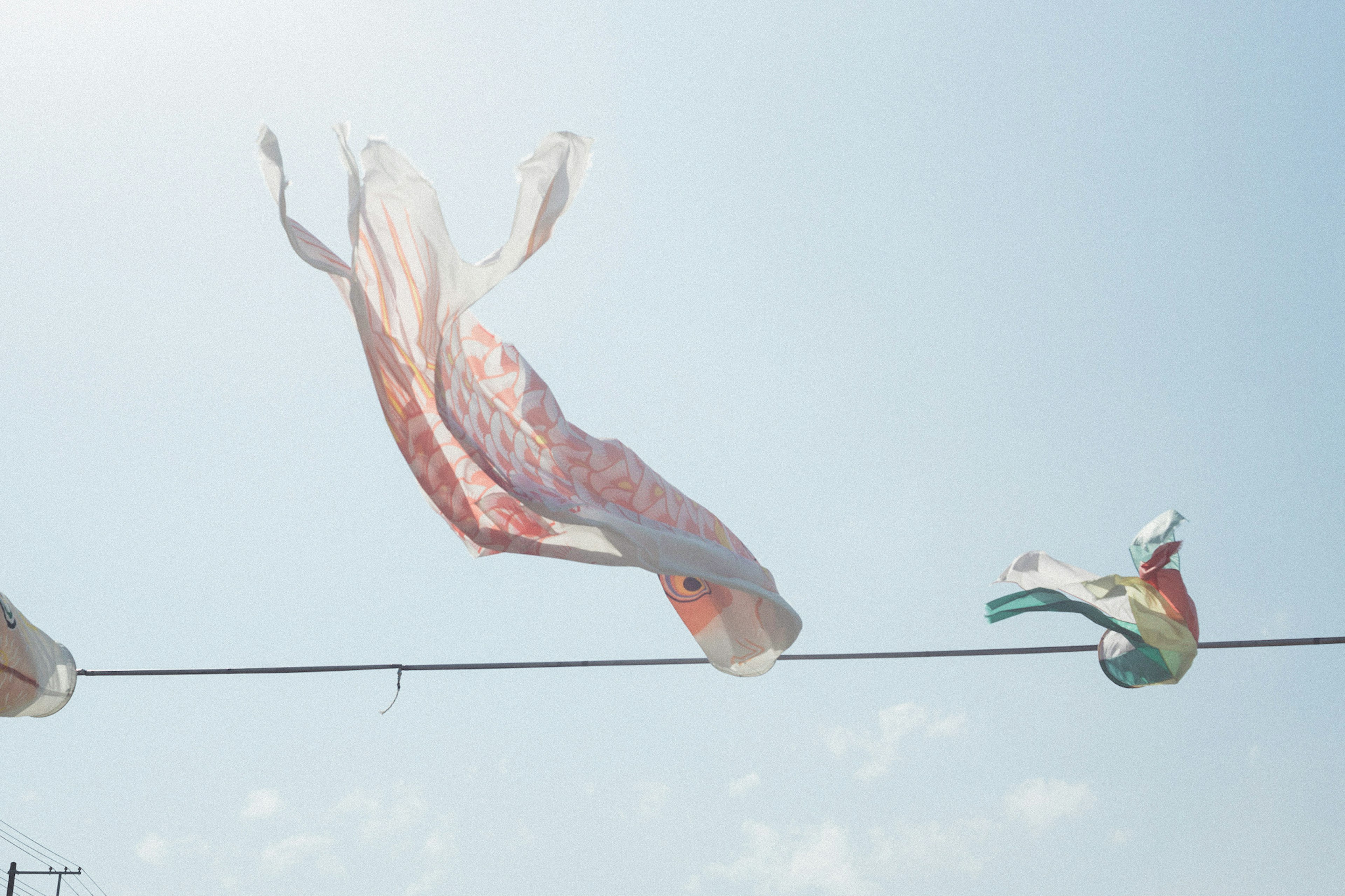 Colorful cloth and flags fluttering in the wind under a blue sky