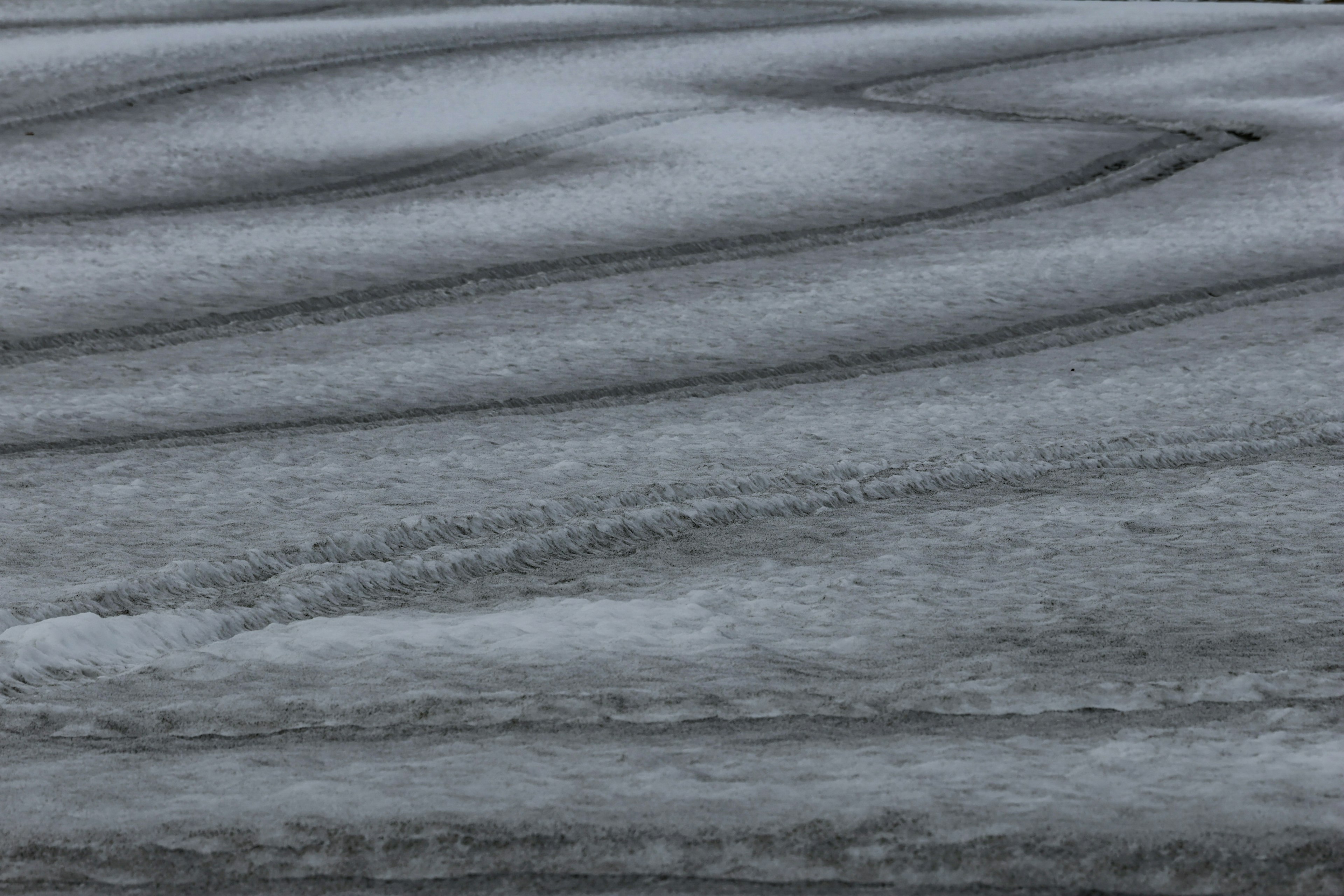 Textured surface of frozen water with ripples