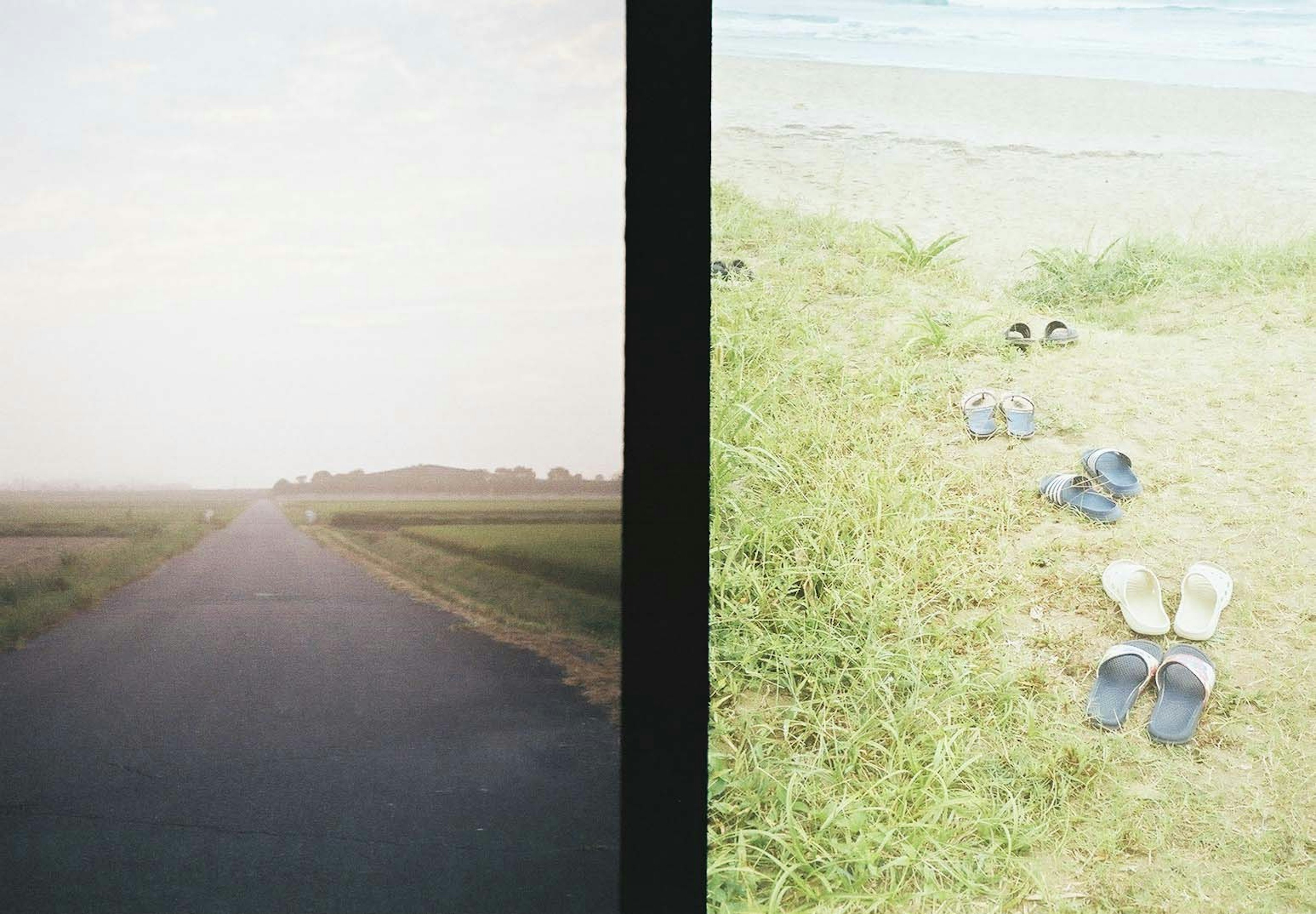 A long road under a cloudy sky and sandals lined up on grass