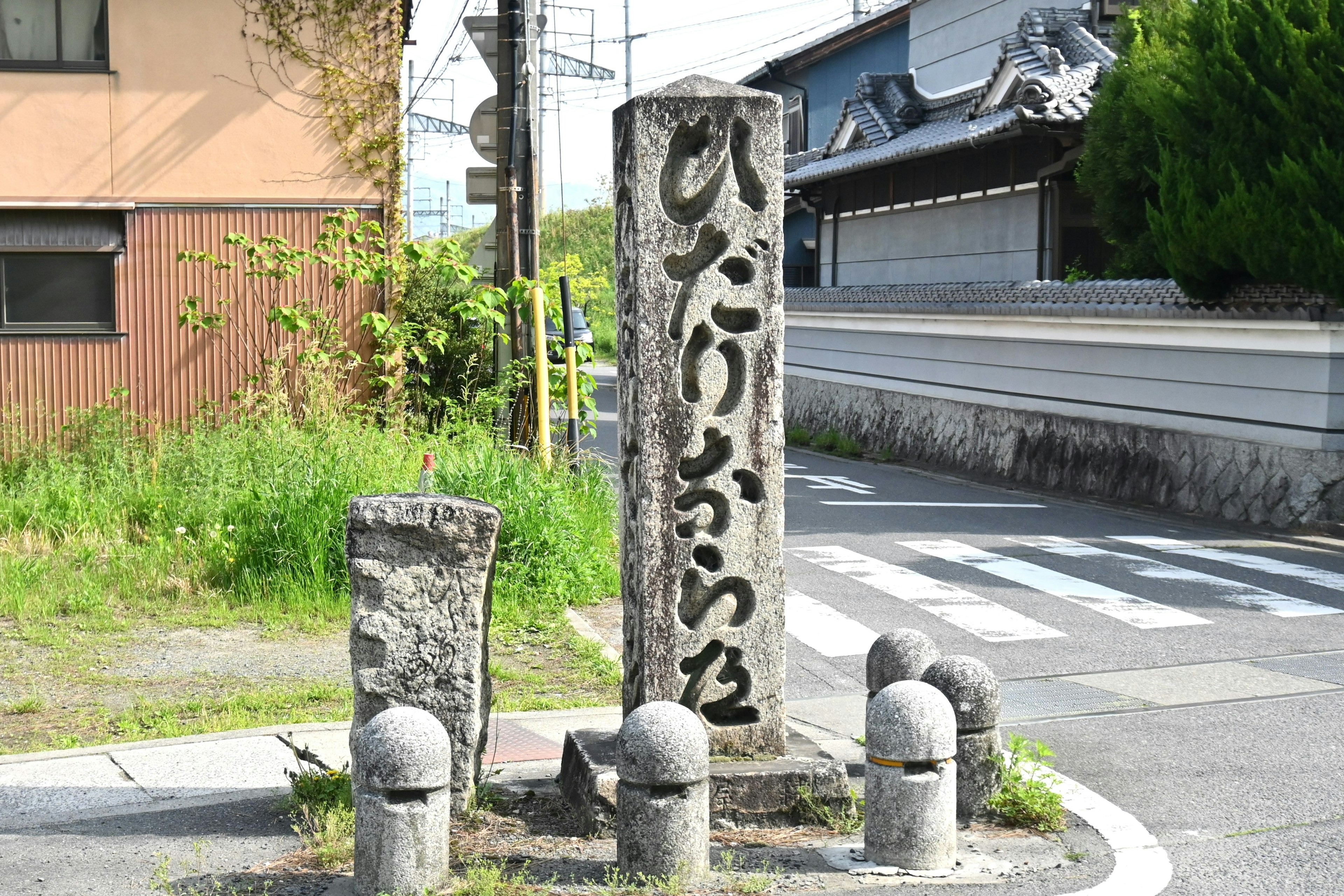 Scenic view of an intersection with a stone sign