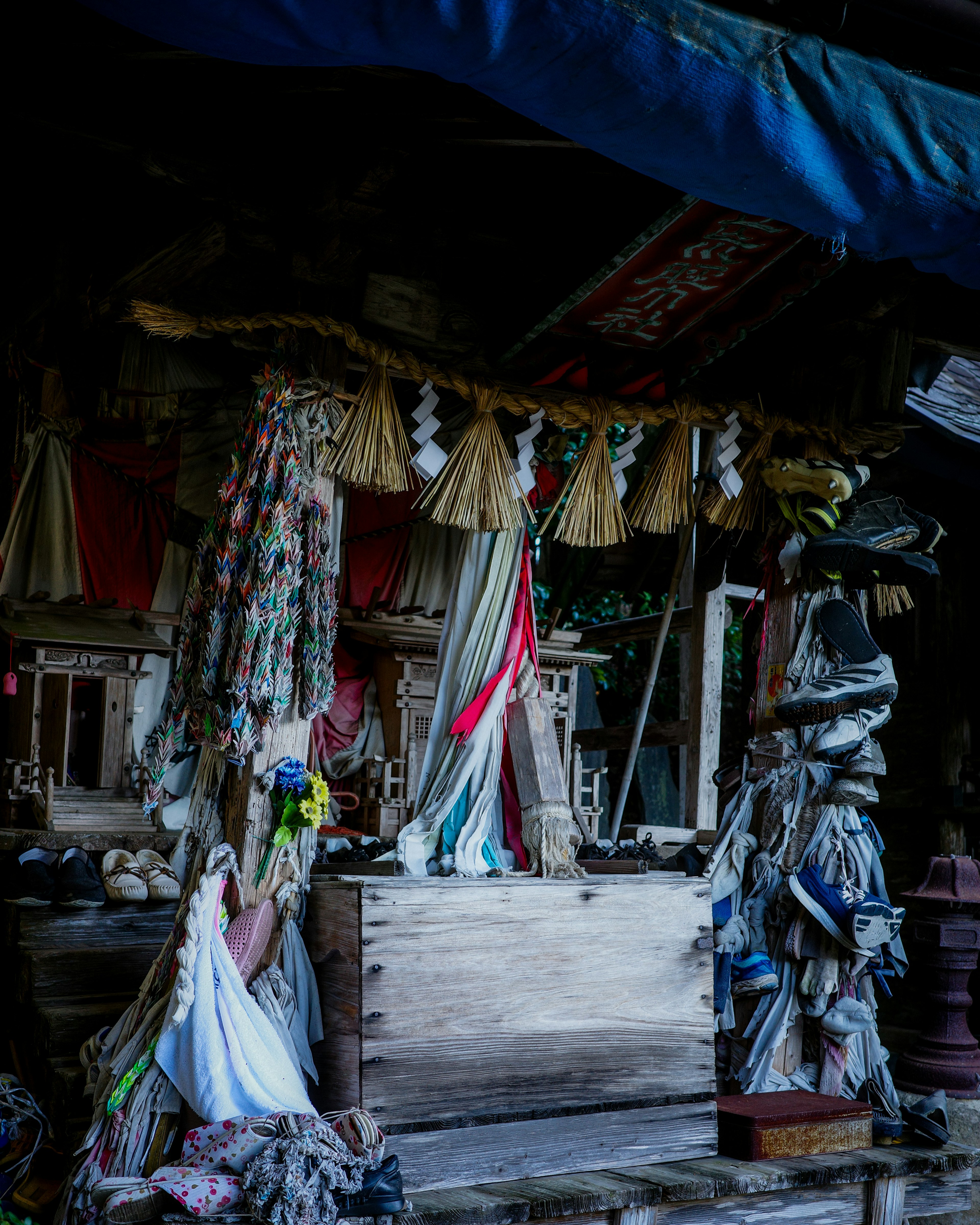 Image of a traditional altar adorned with colorful fabrics and decorations