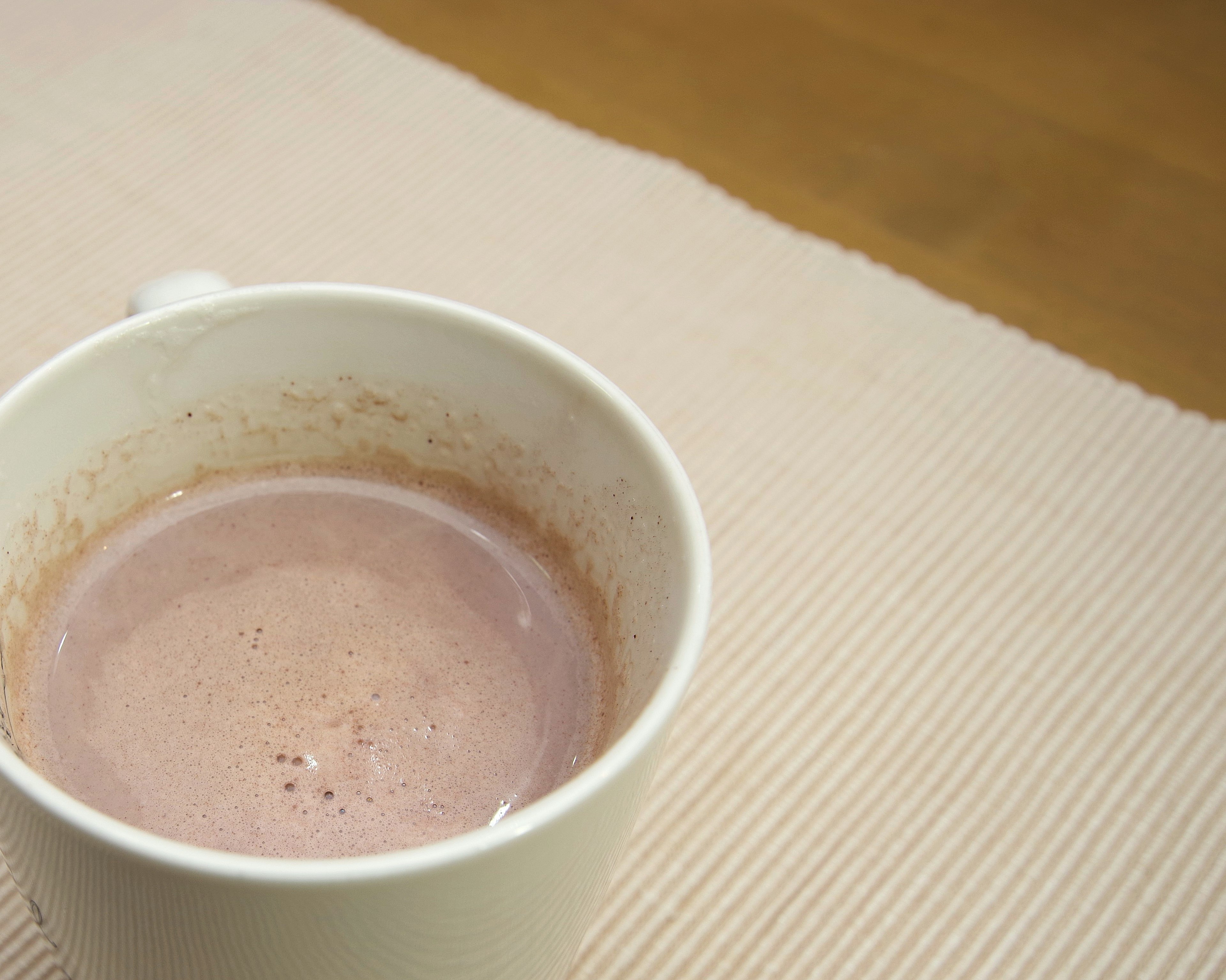 Warm cocoa beverage in a white cup