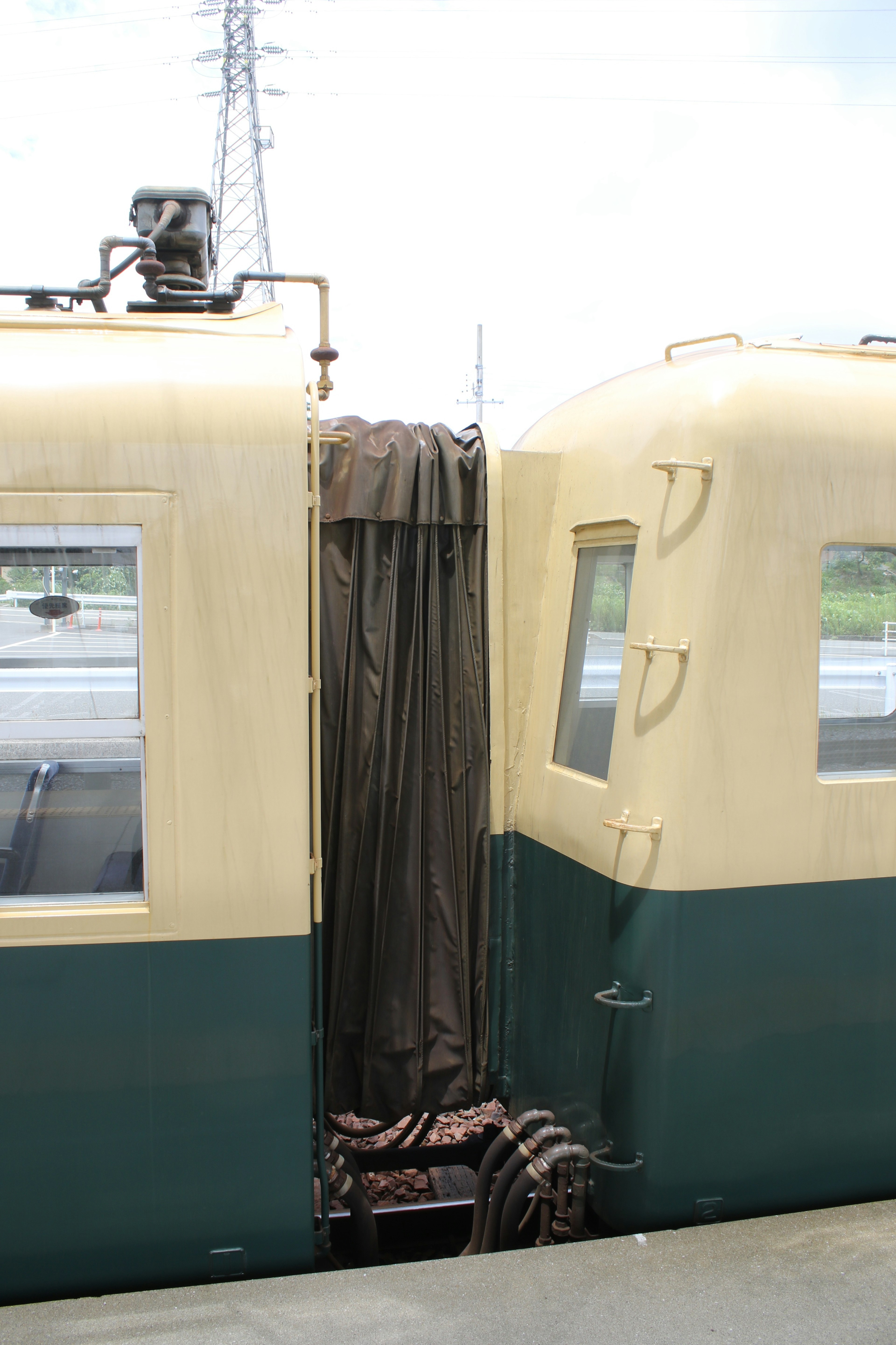 Detail of two train cars connected with a curtain