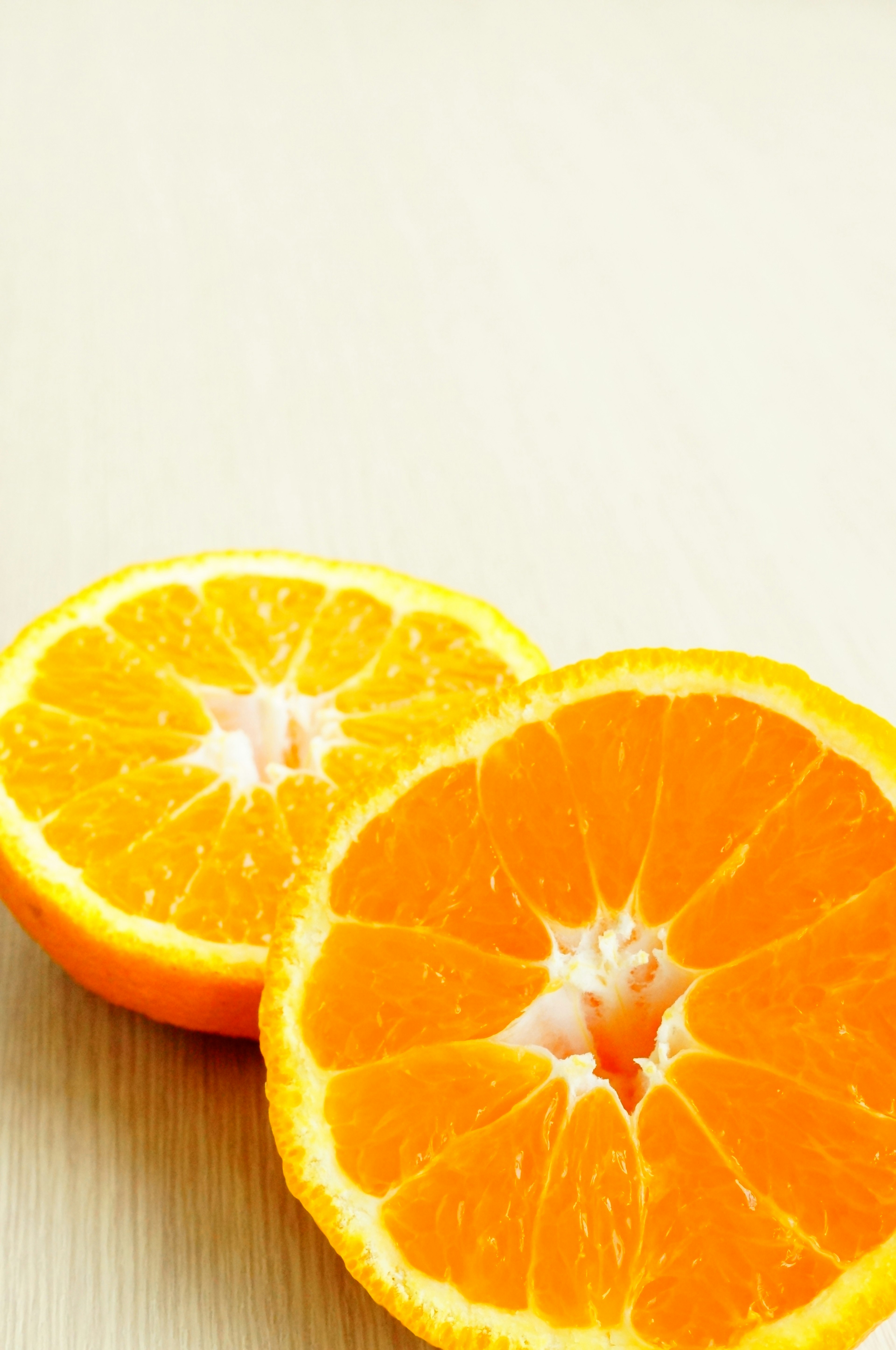 Vibrant orange fruit cut in half