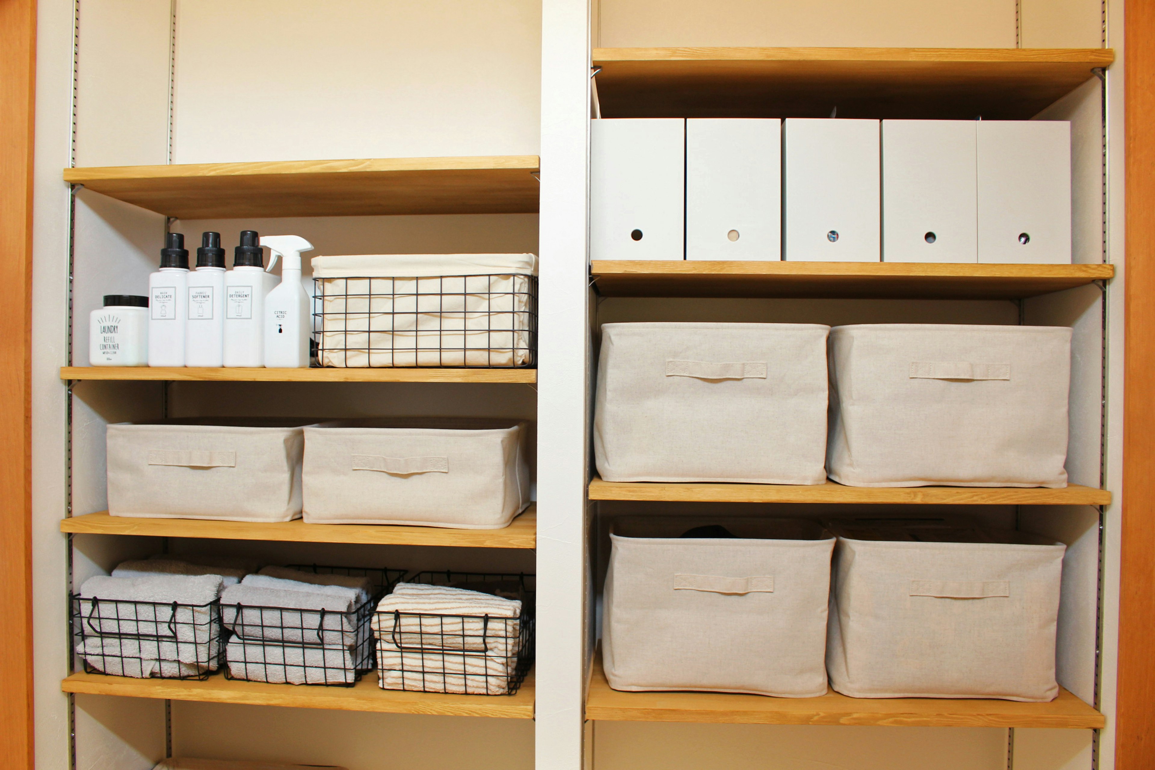 Organized shelves with bath products and storage boxes