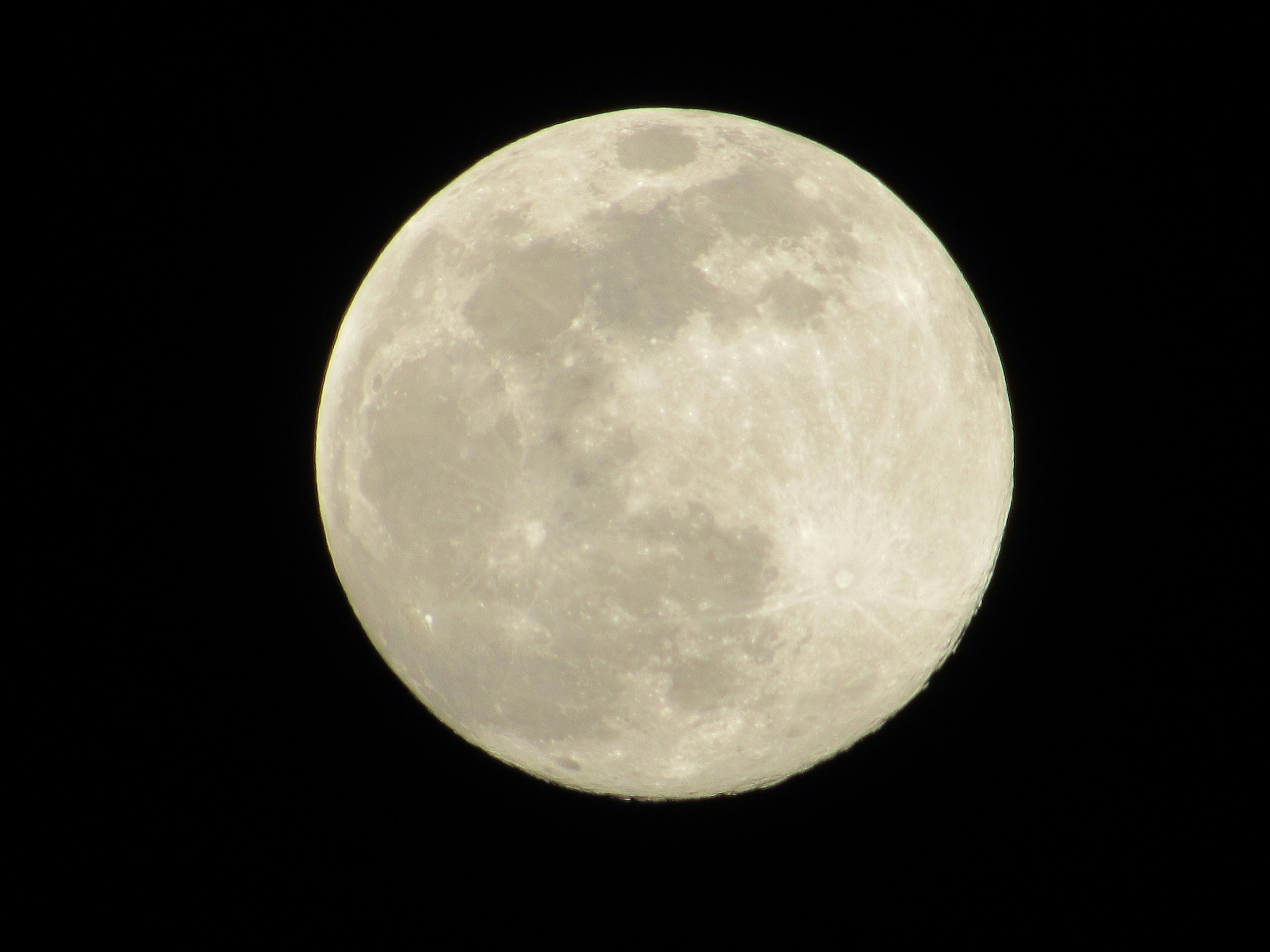 Detailed image of a full moon bright against a black background