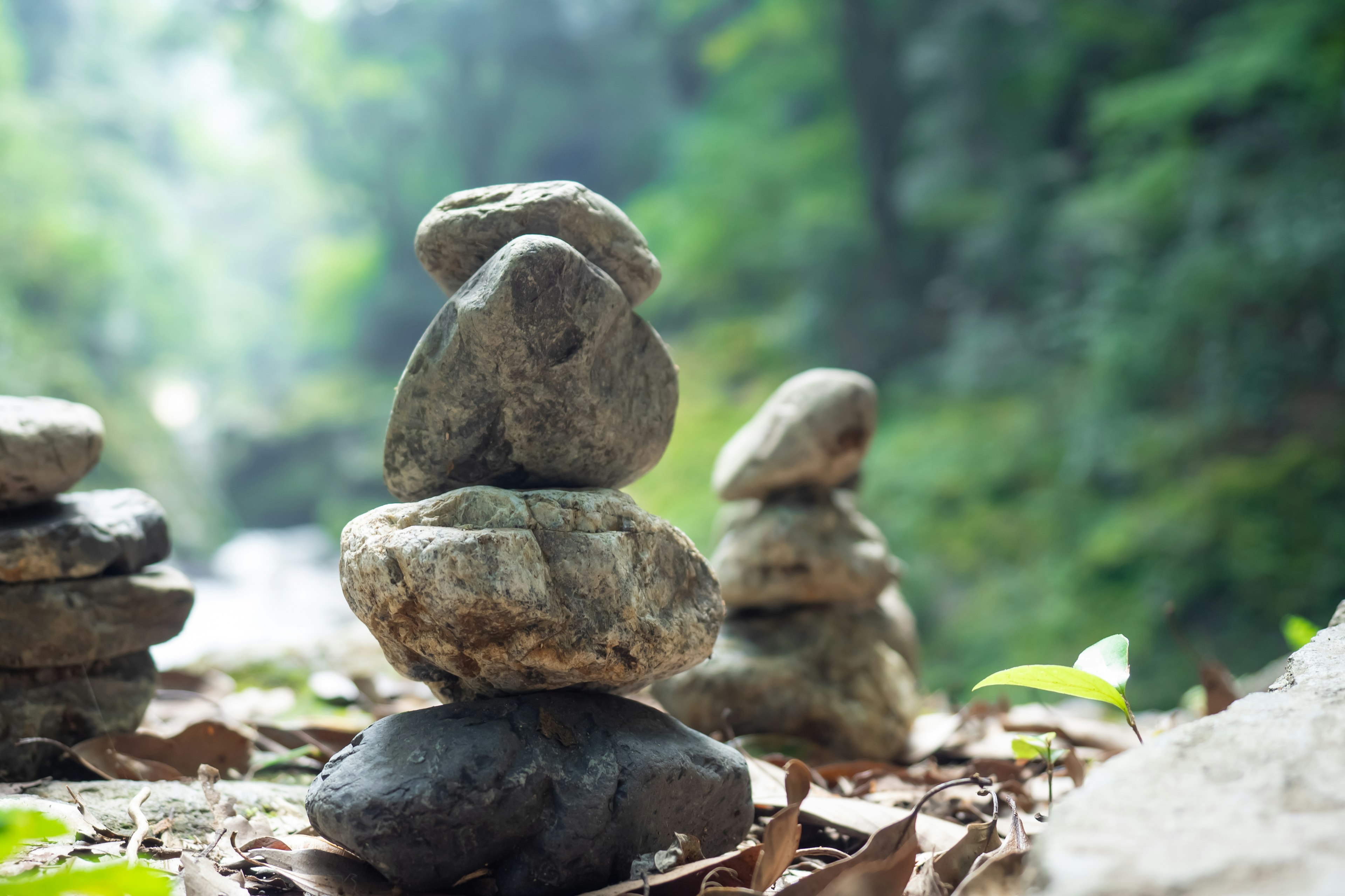 Stacked stones near a tranquil river