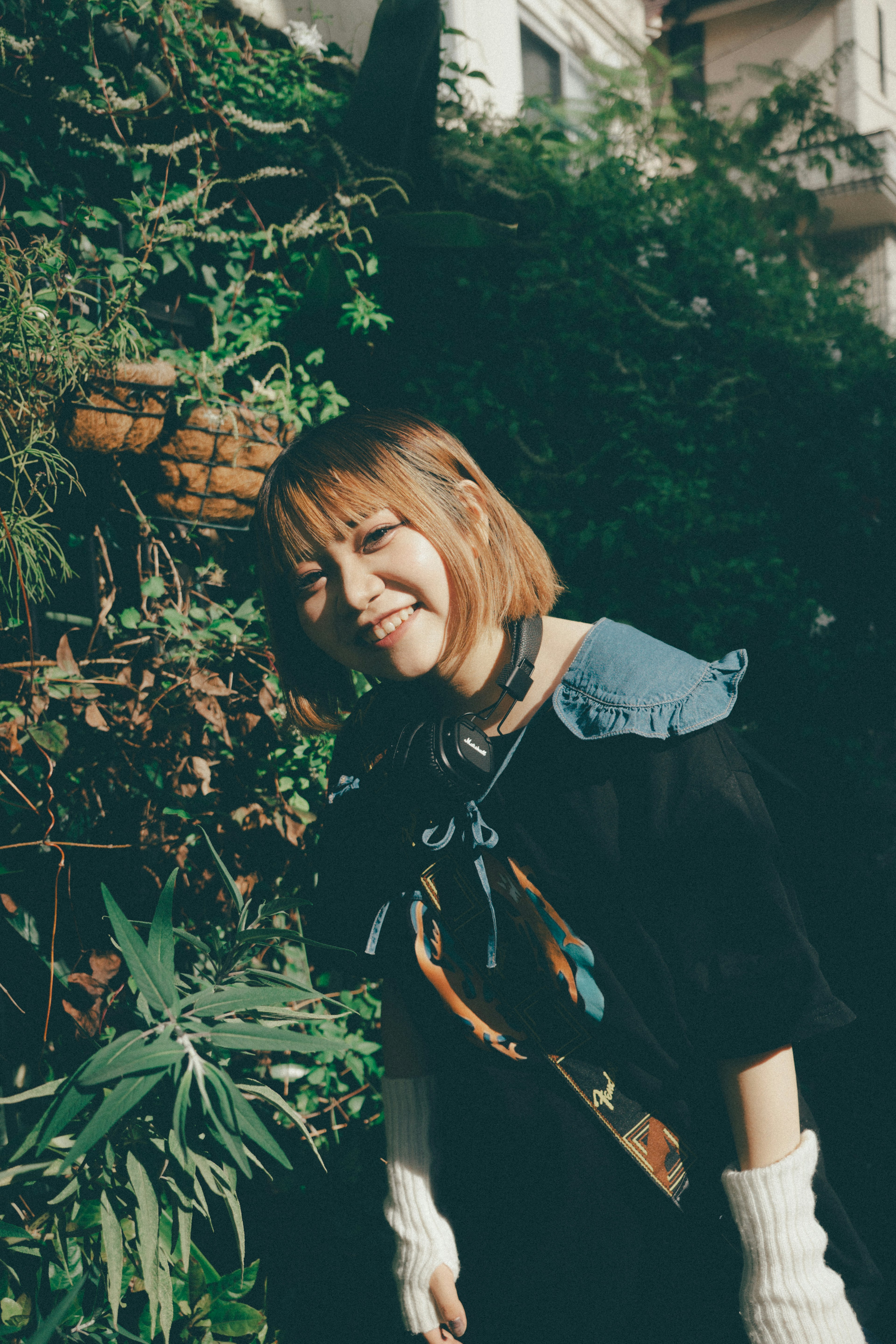 Portrait of a smiling woman in front of a green background