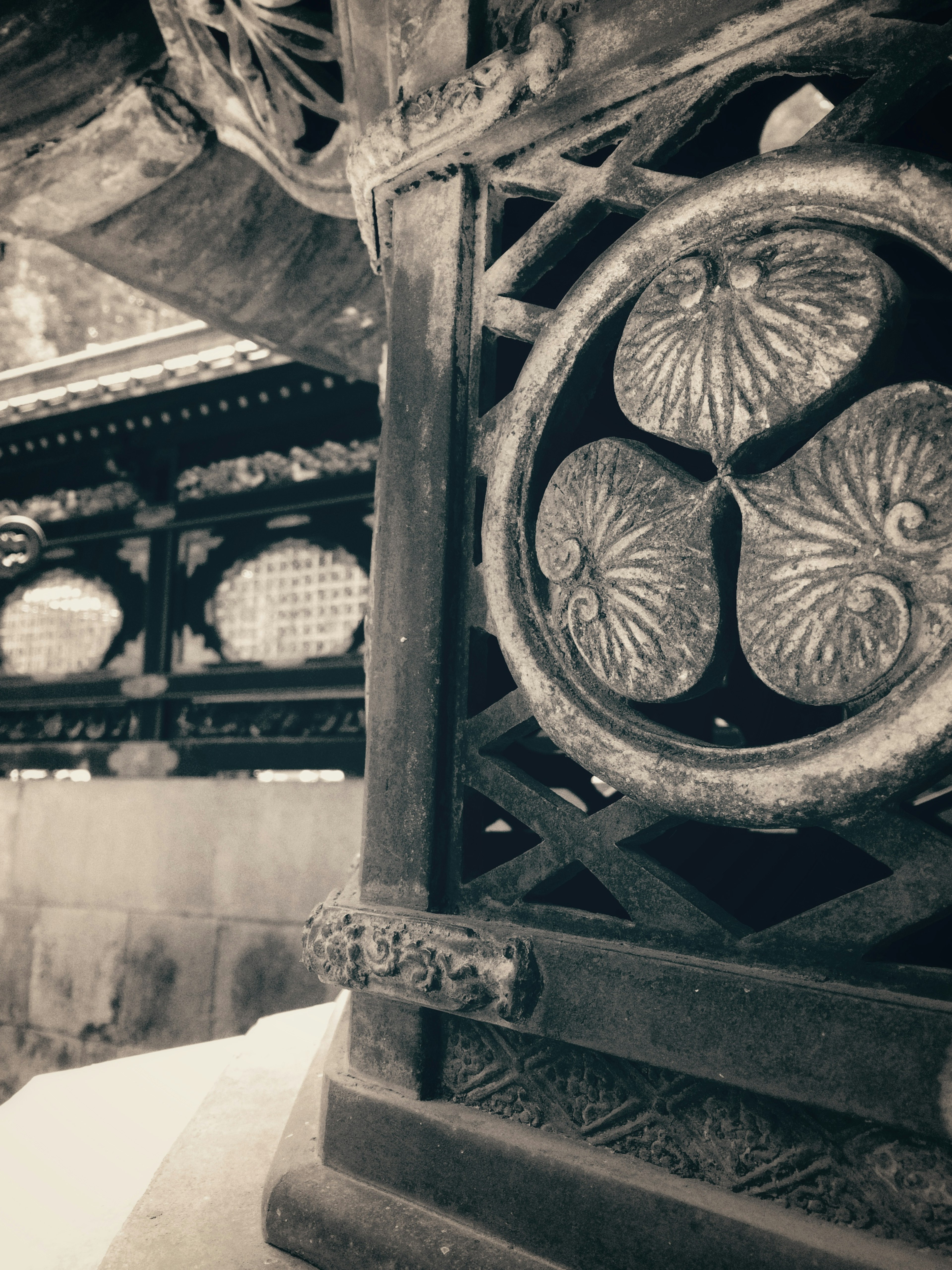 Close-up of an ornate circular wooden carving with intricate designs