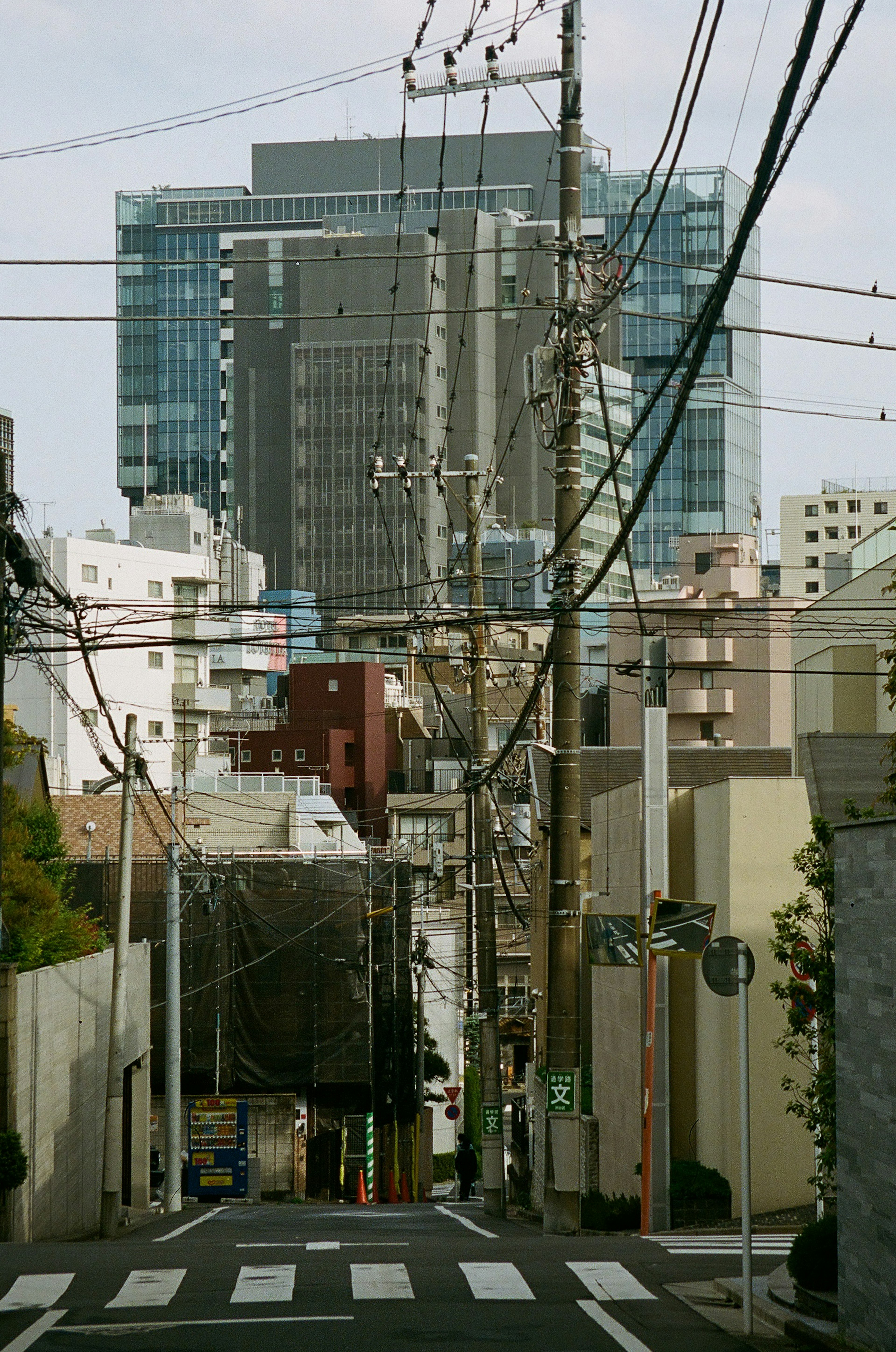 Cityscape featuring tall buildings and power lines