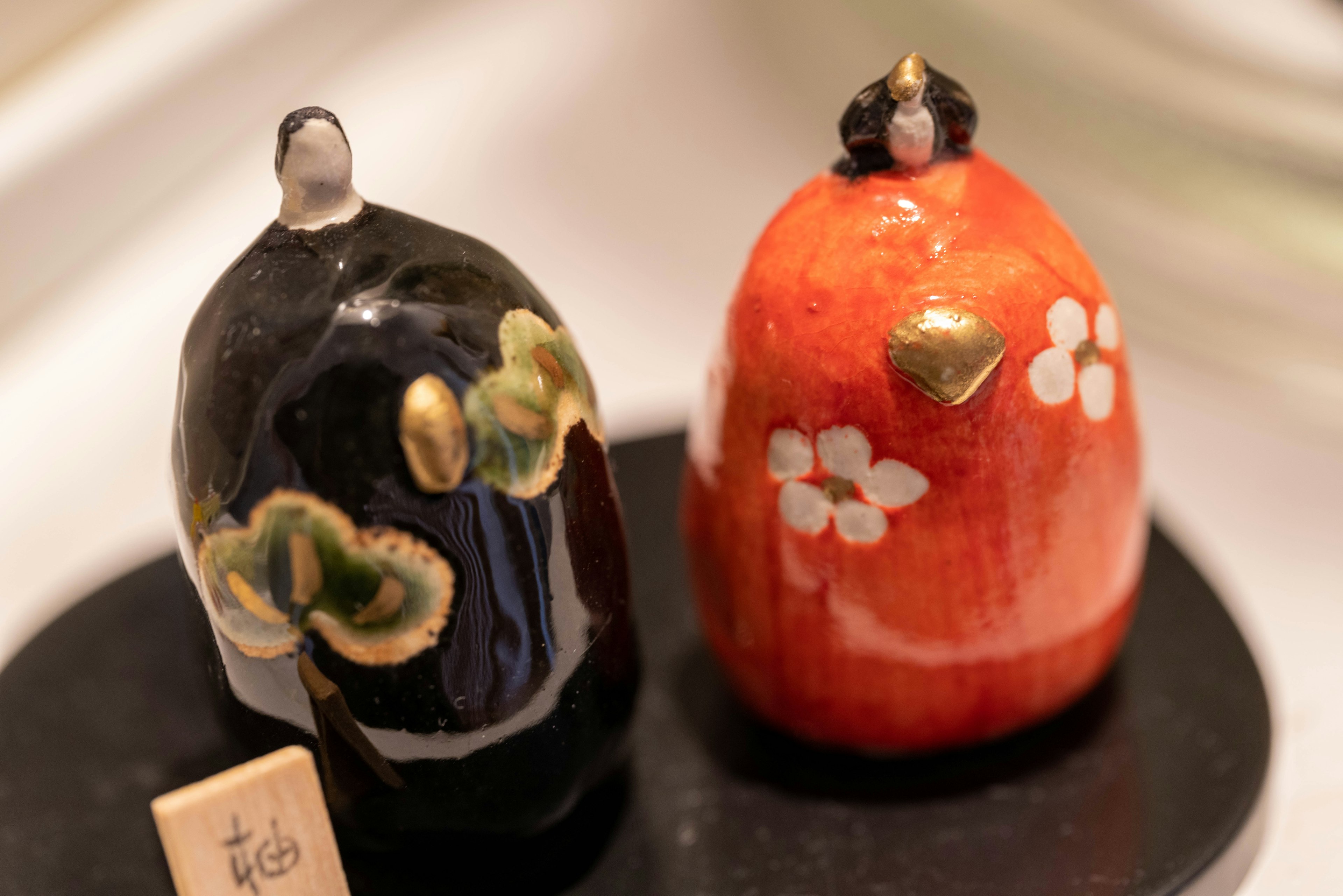 Beautiful display of black and red ceramic figurines