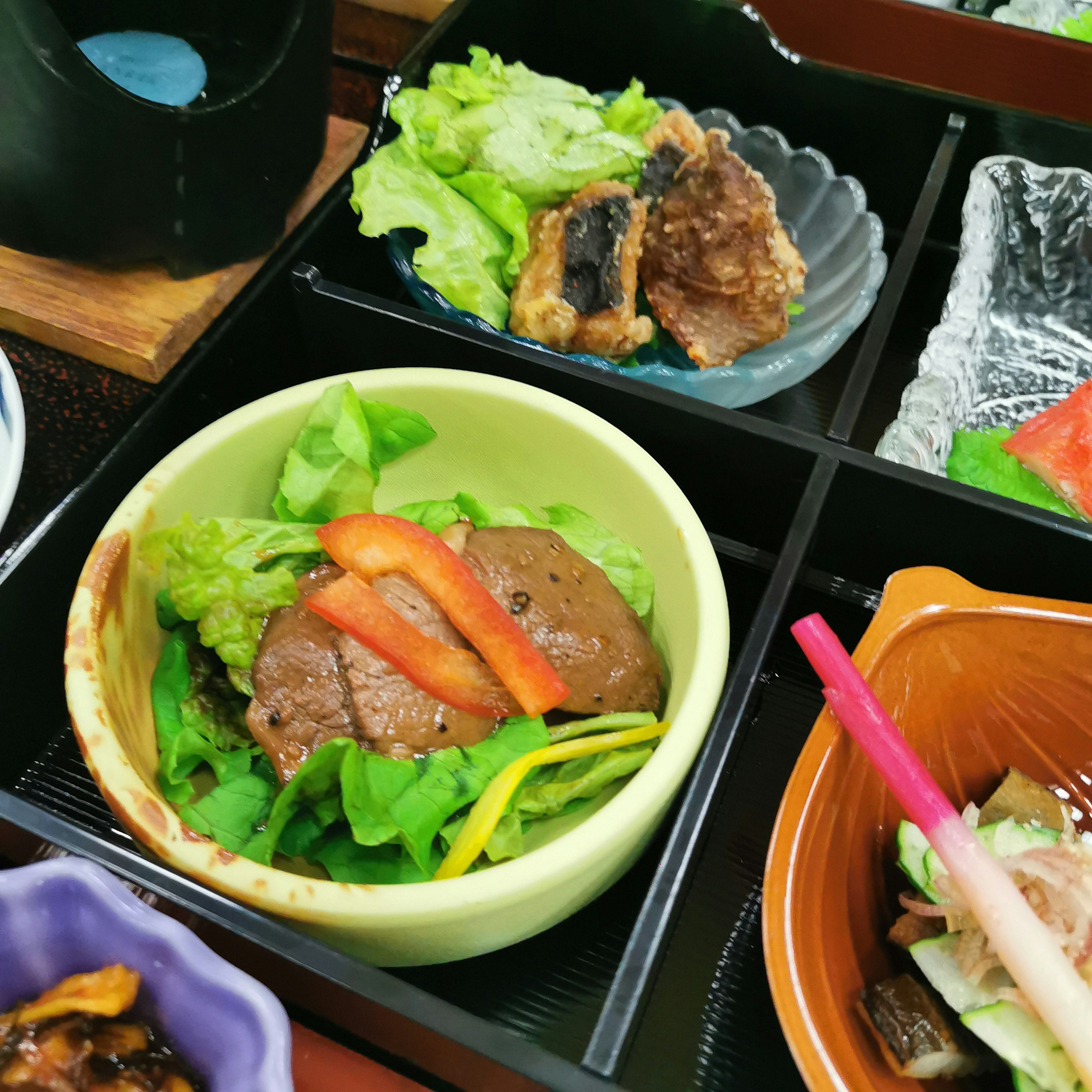 A beautifully arranged Japanese meal with colorful ingredients