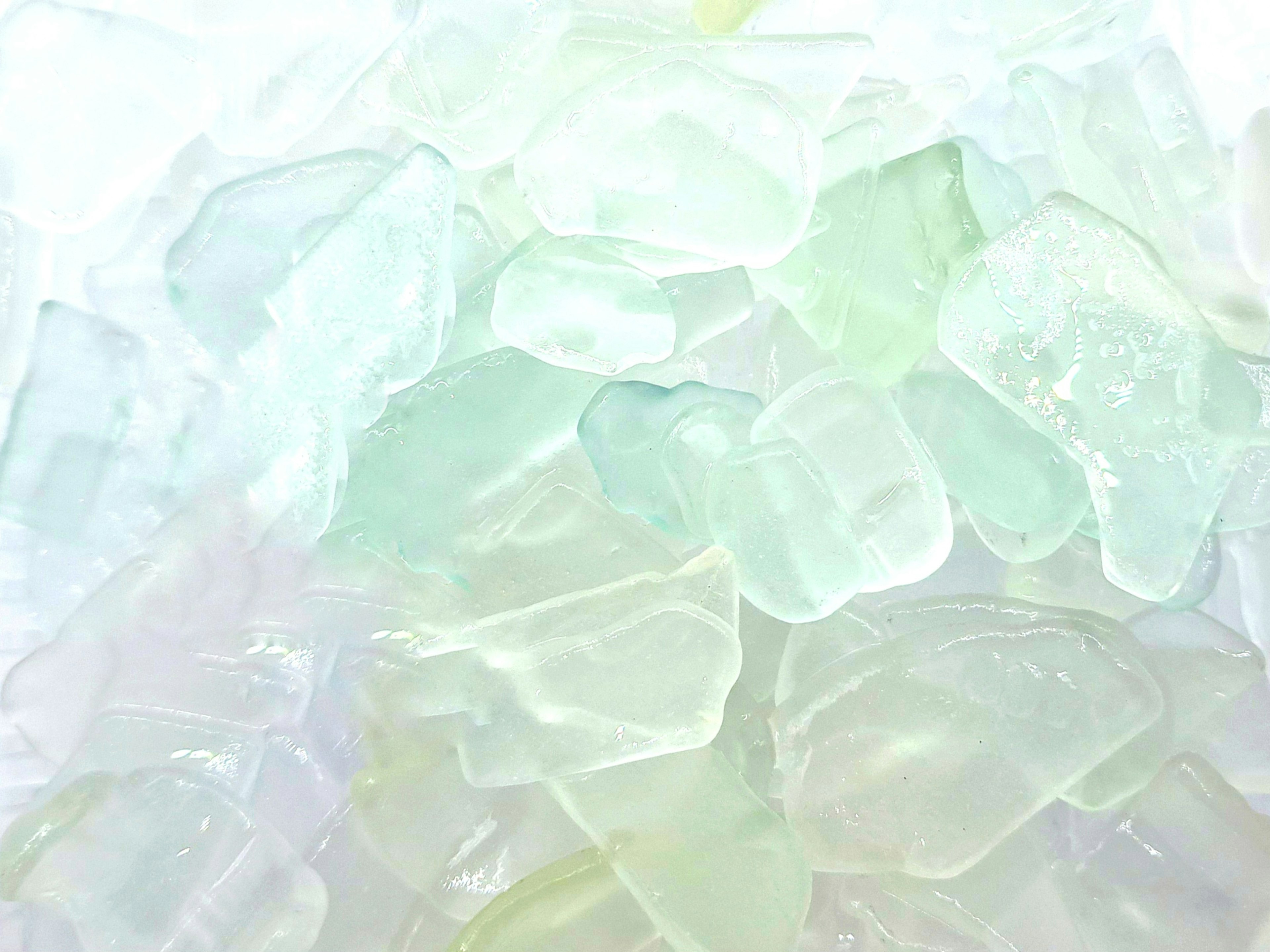 A close-up of transparent glass pieces overlapping each other