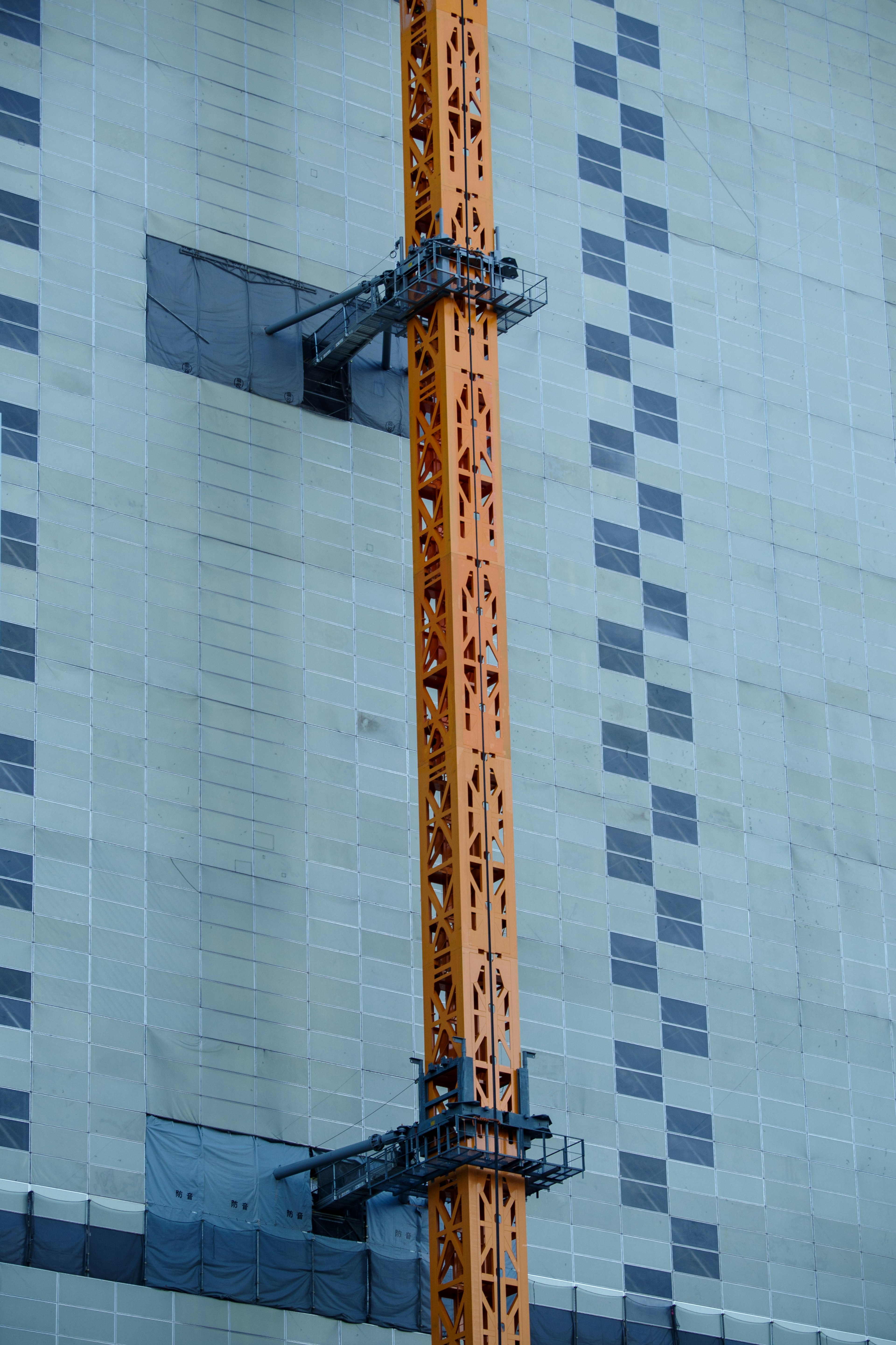 Detail of a construction crane on a high-rise building