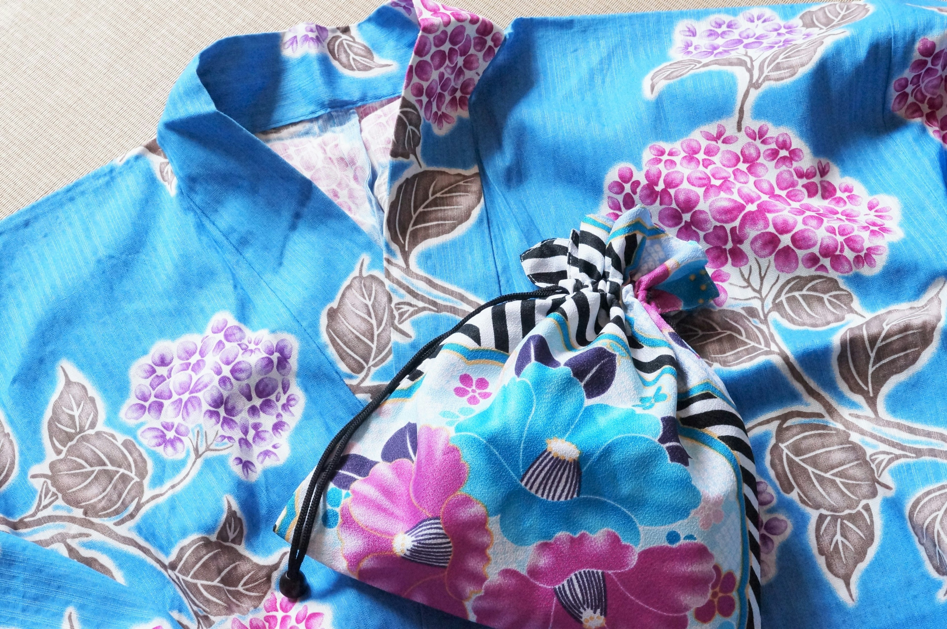 Blue floral kimono with colorful flower-patterned pouch