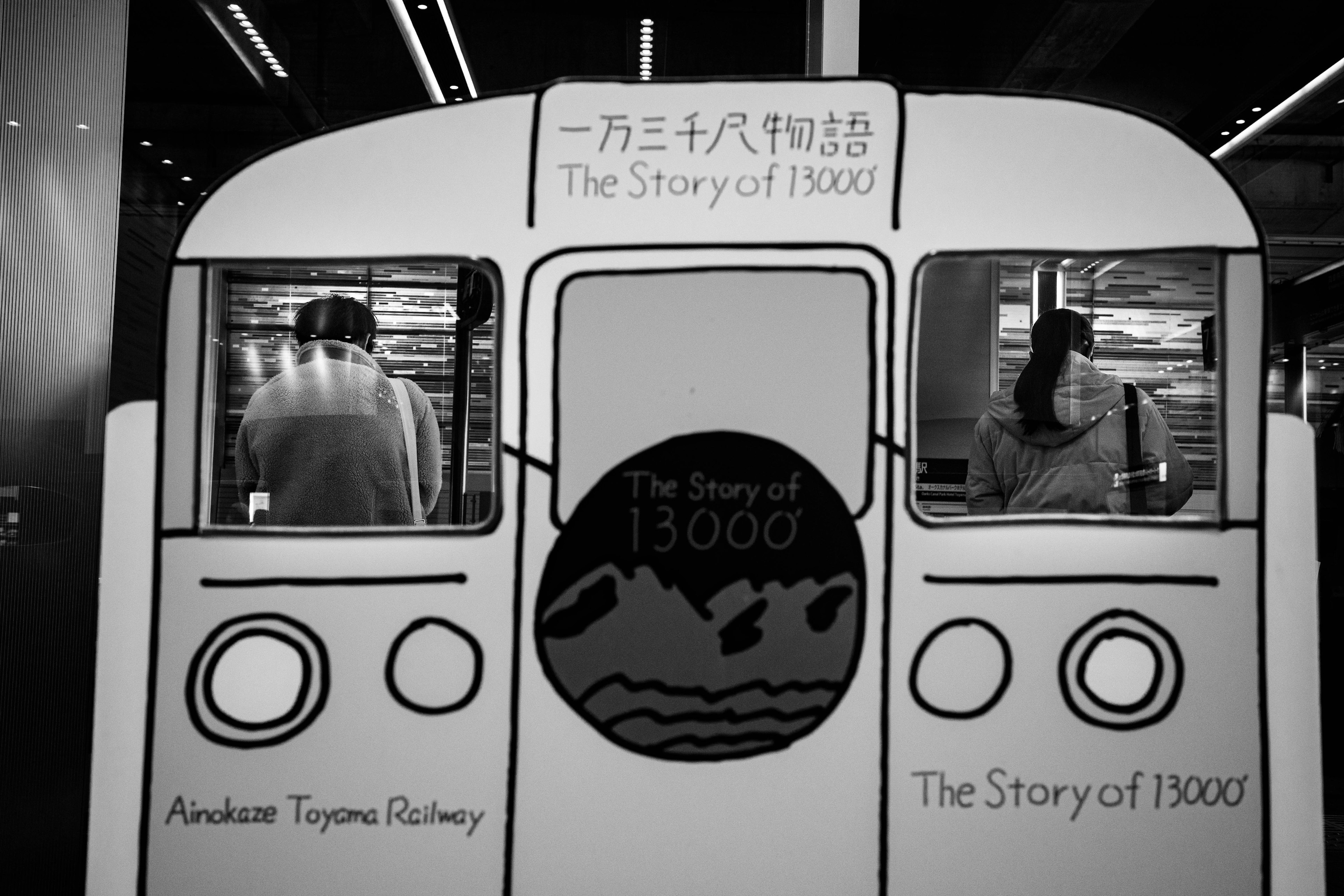 Black and white image of two people working at the Anderson Tunnels Railway exhibit