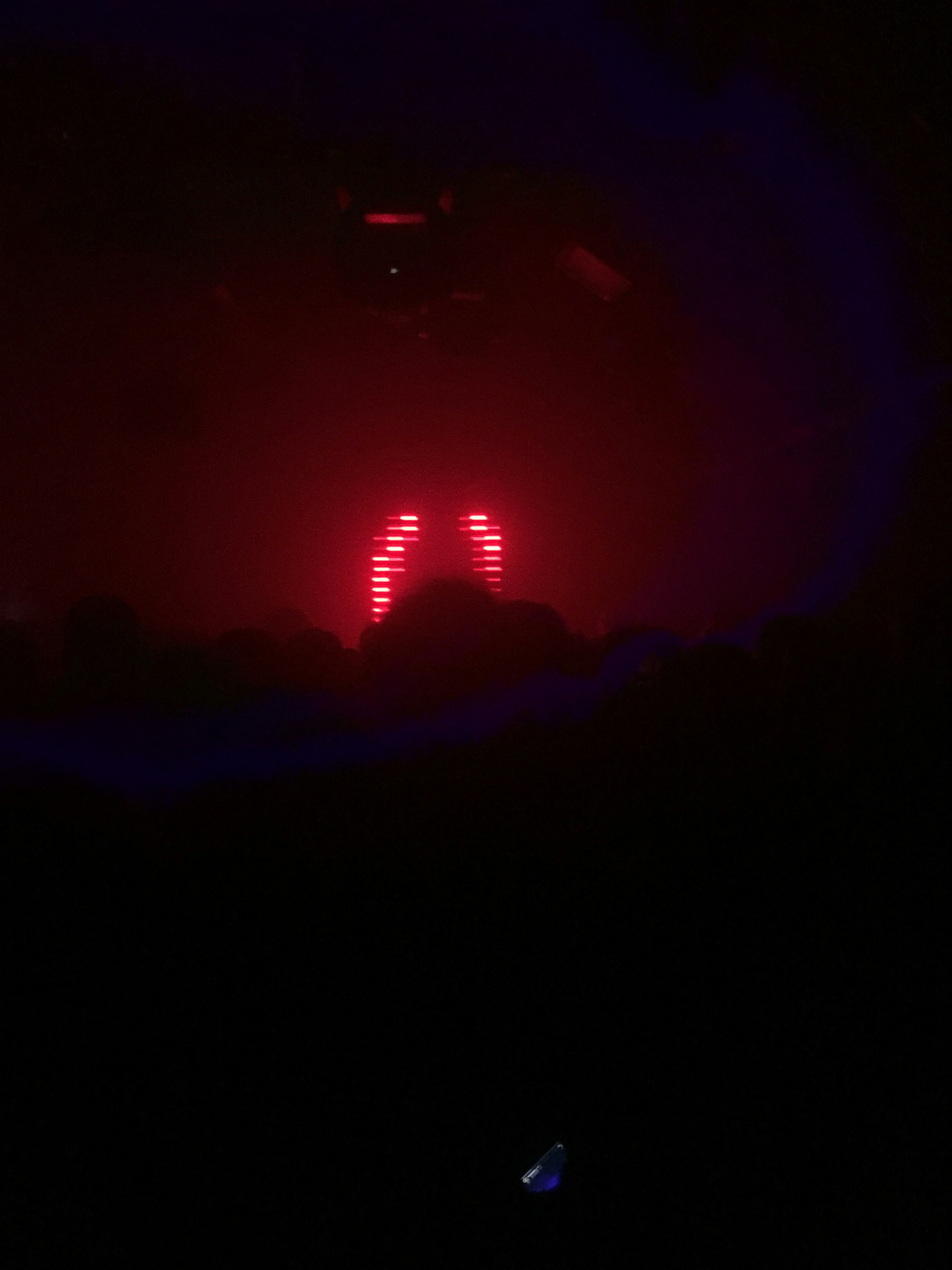 A club scene with flashing red LED lights