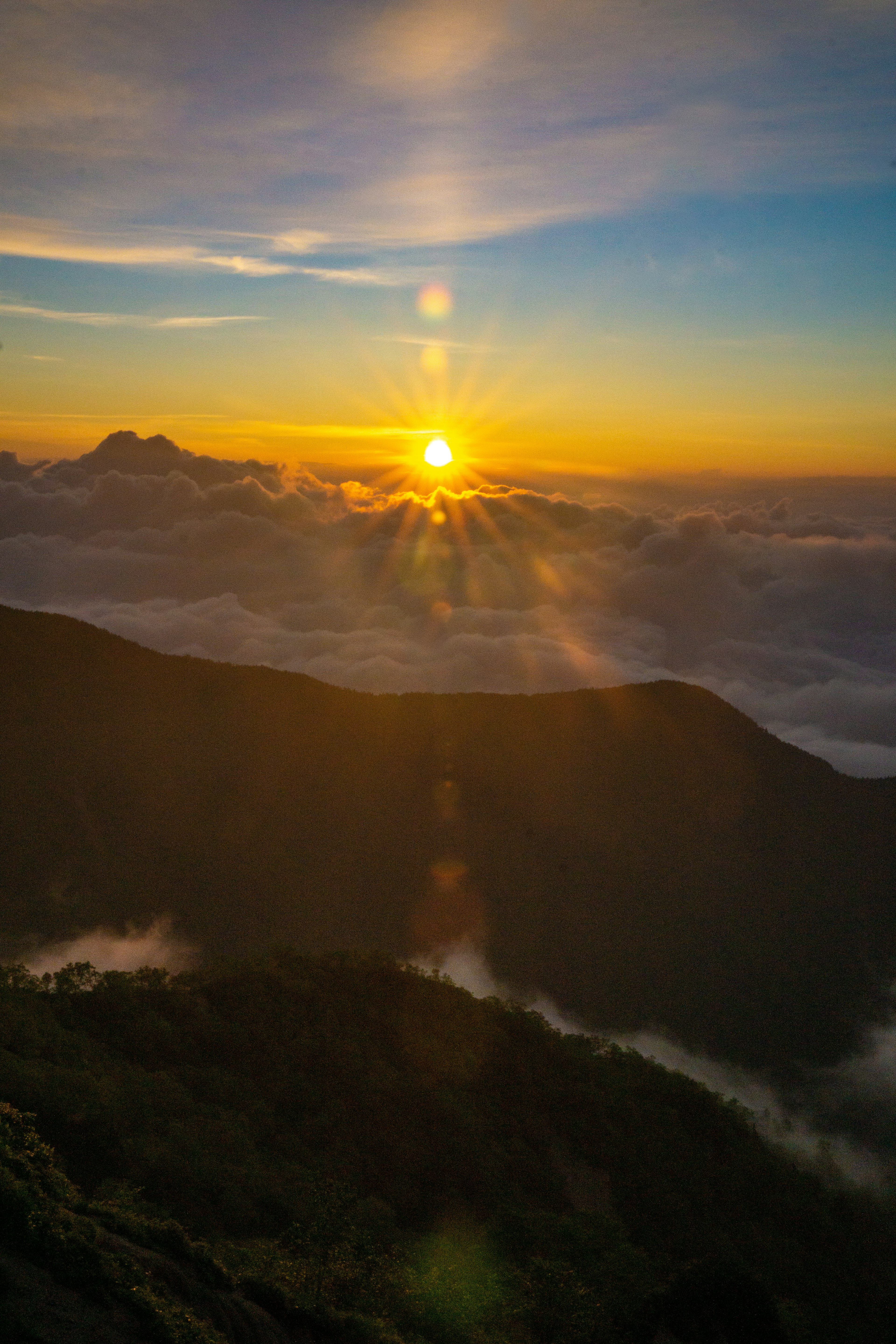 Beautiful sunrise over mountains with clouds and valleys