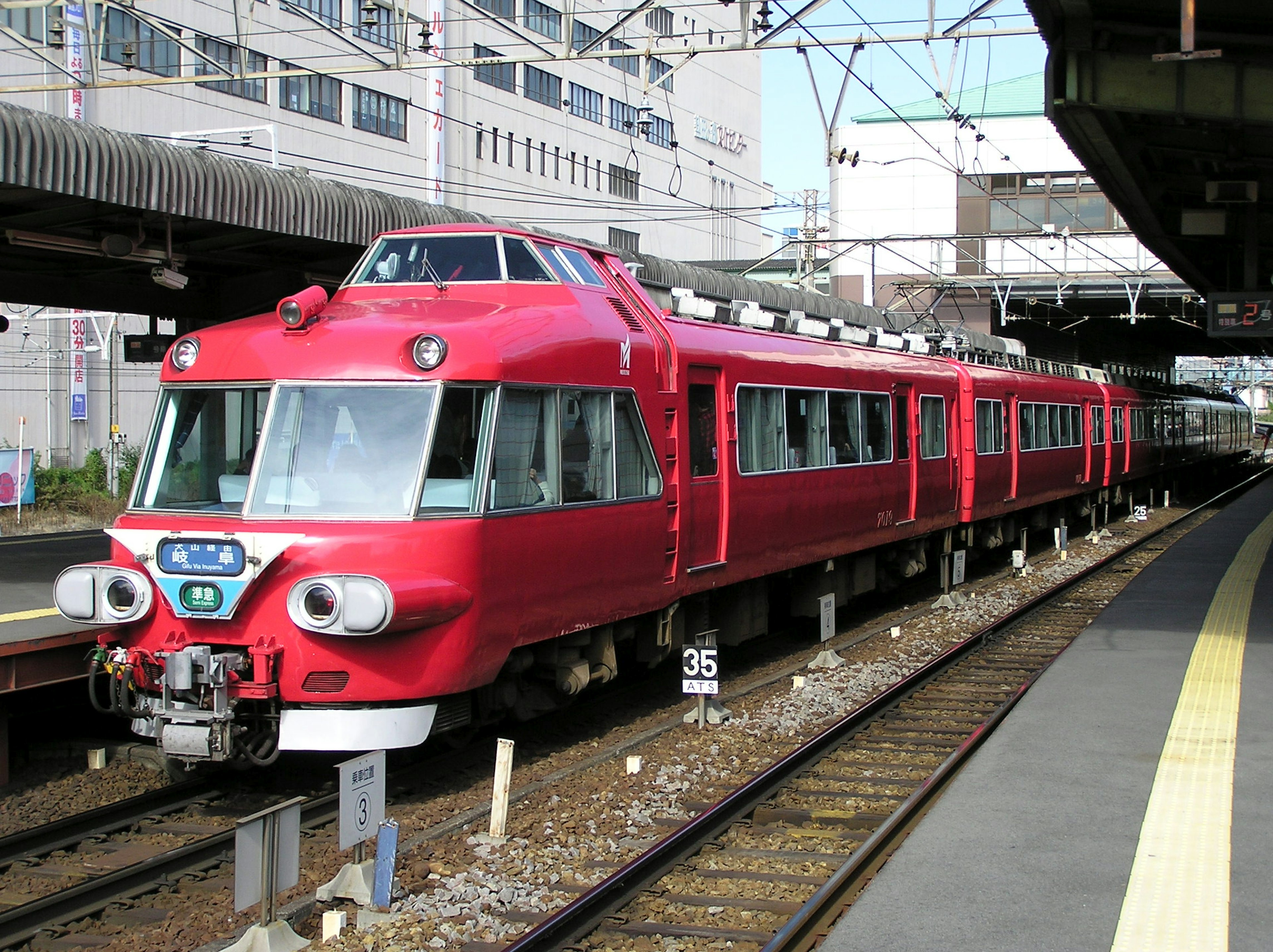 Red express train stopped at a station