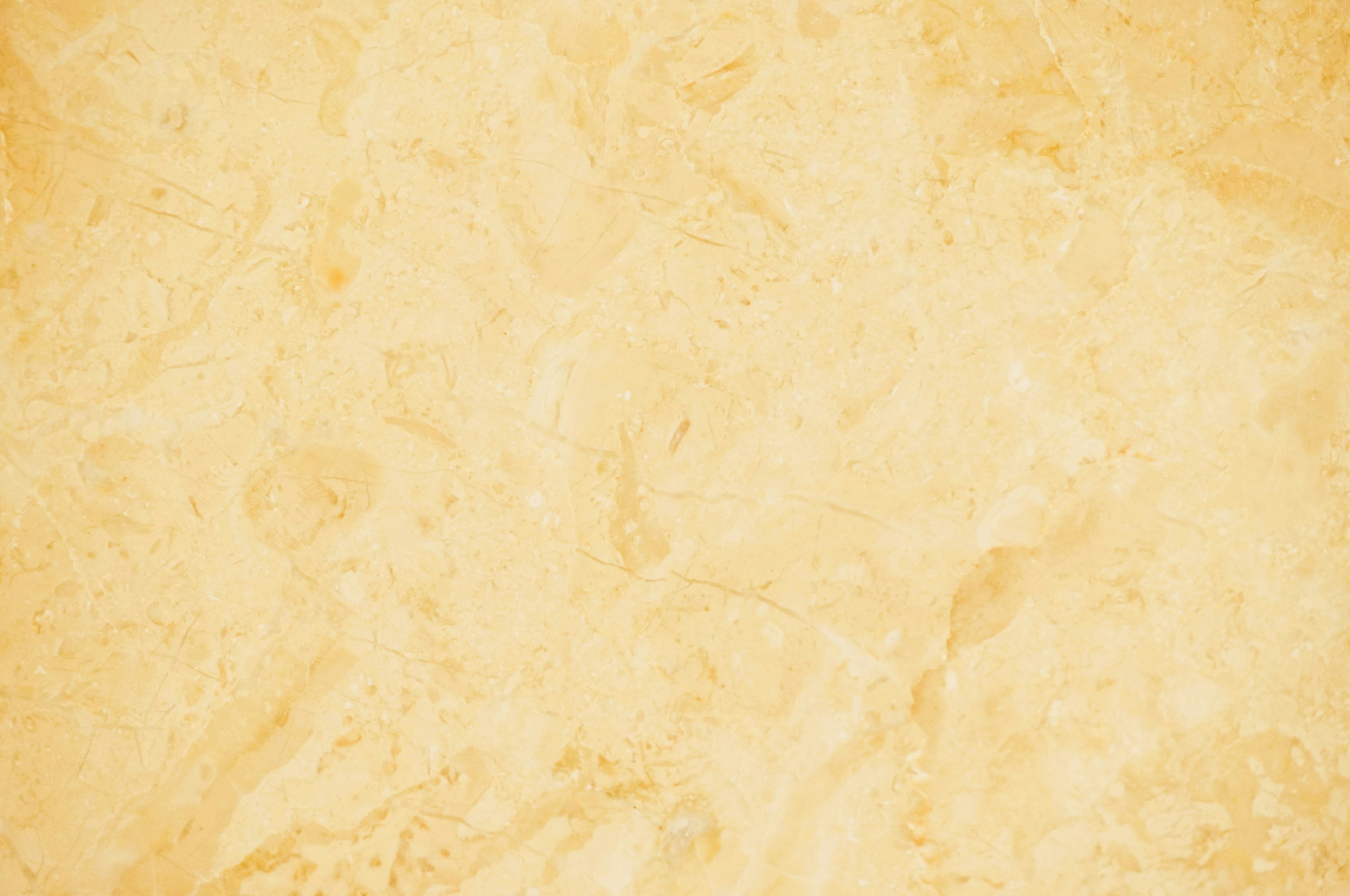 Fondo de textura de mármol amarillo suave