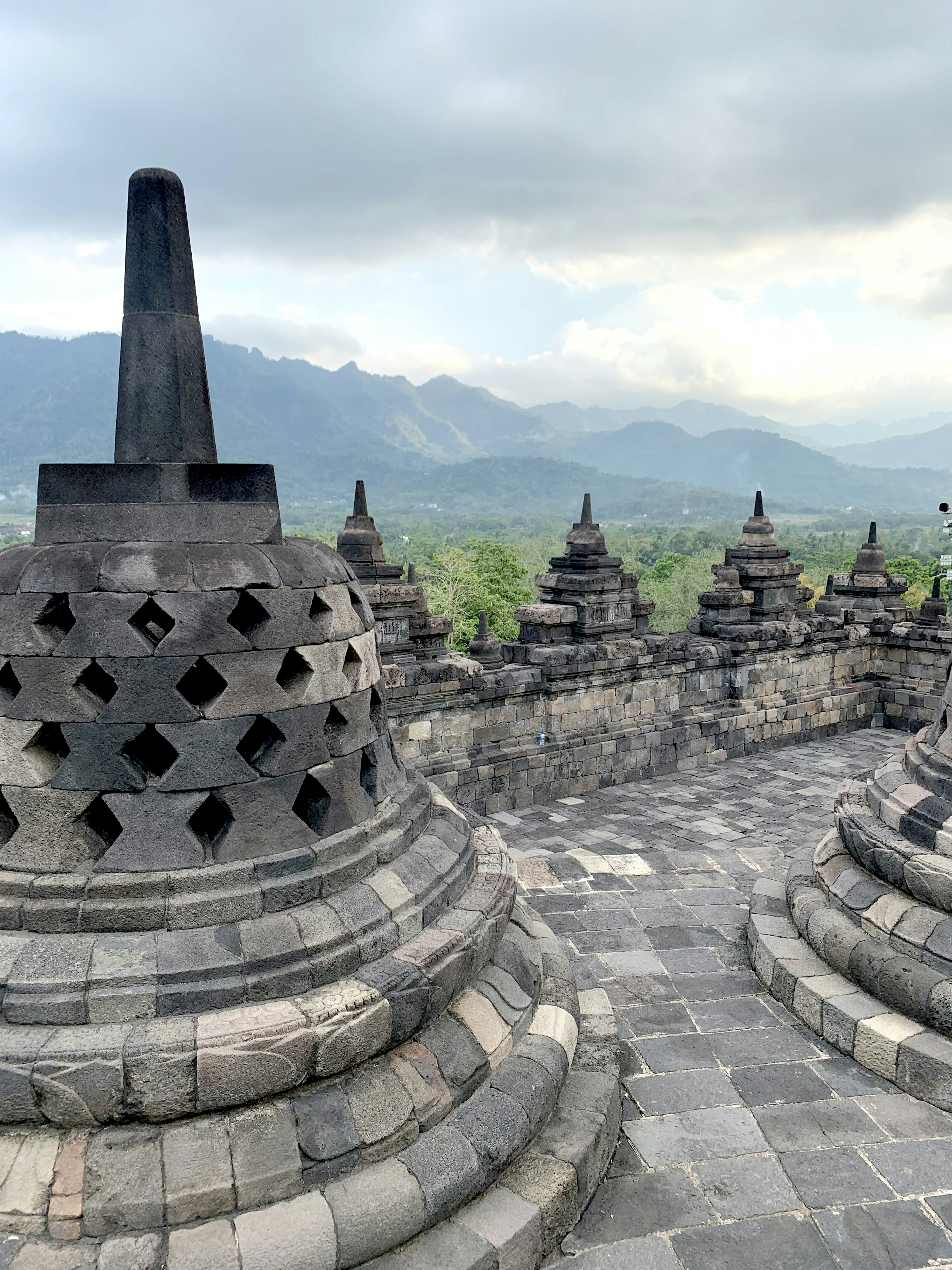 Borobudur temple stupas with mountainous backdrop