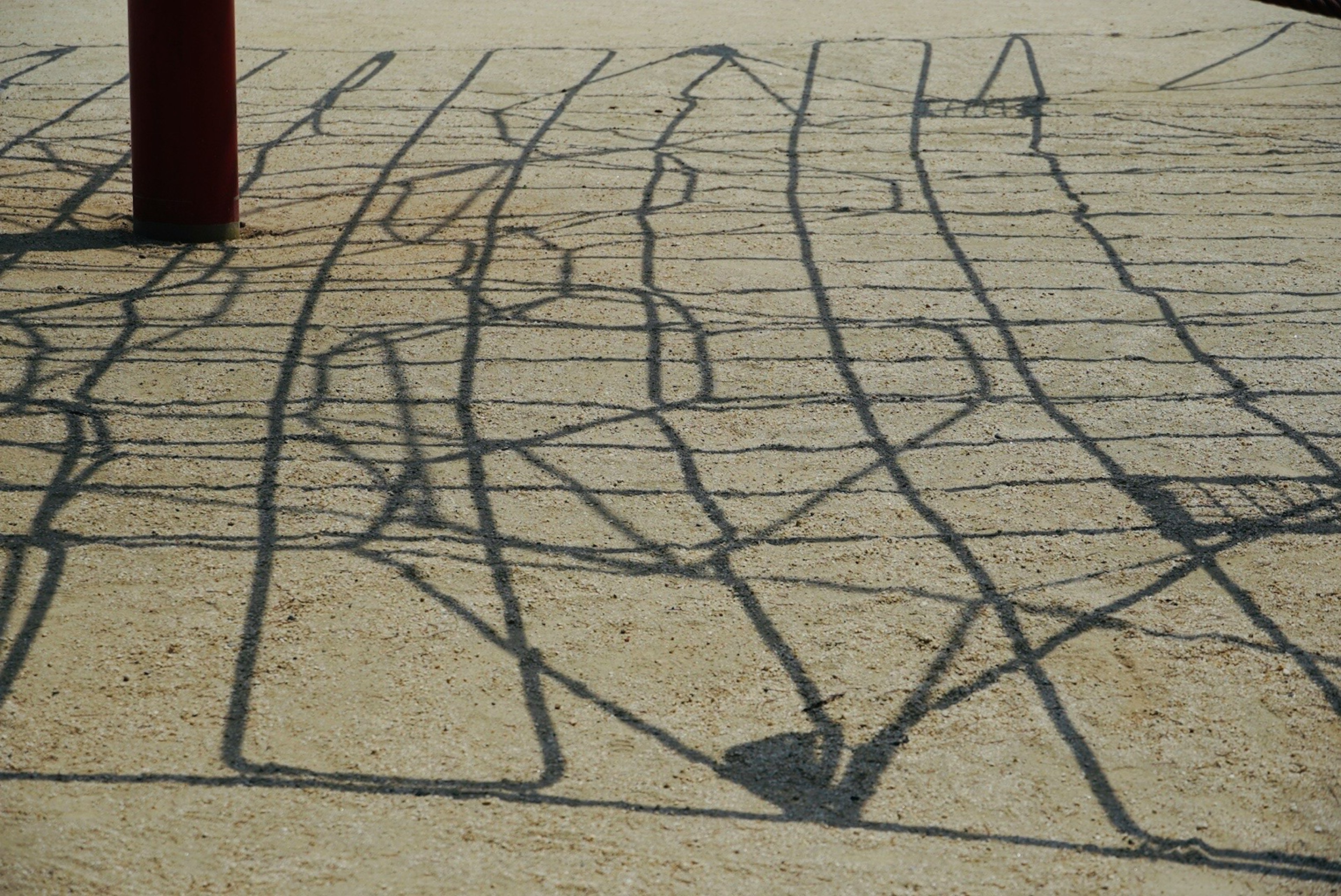 Image of a pavement with cracks and patterns