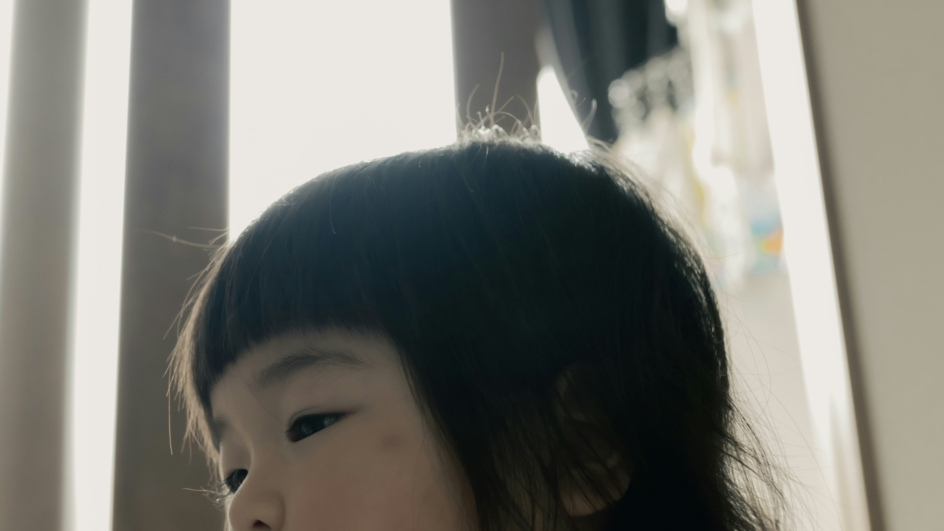 Profile of a child playing in soft light