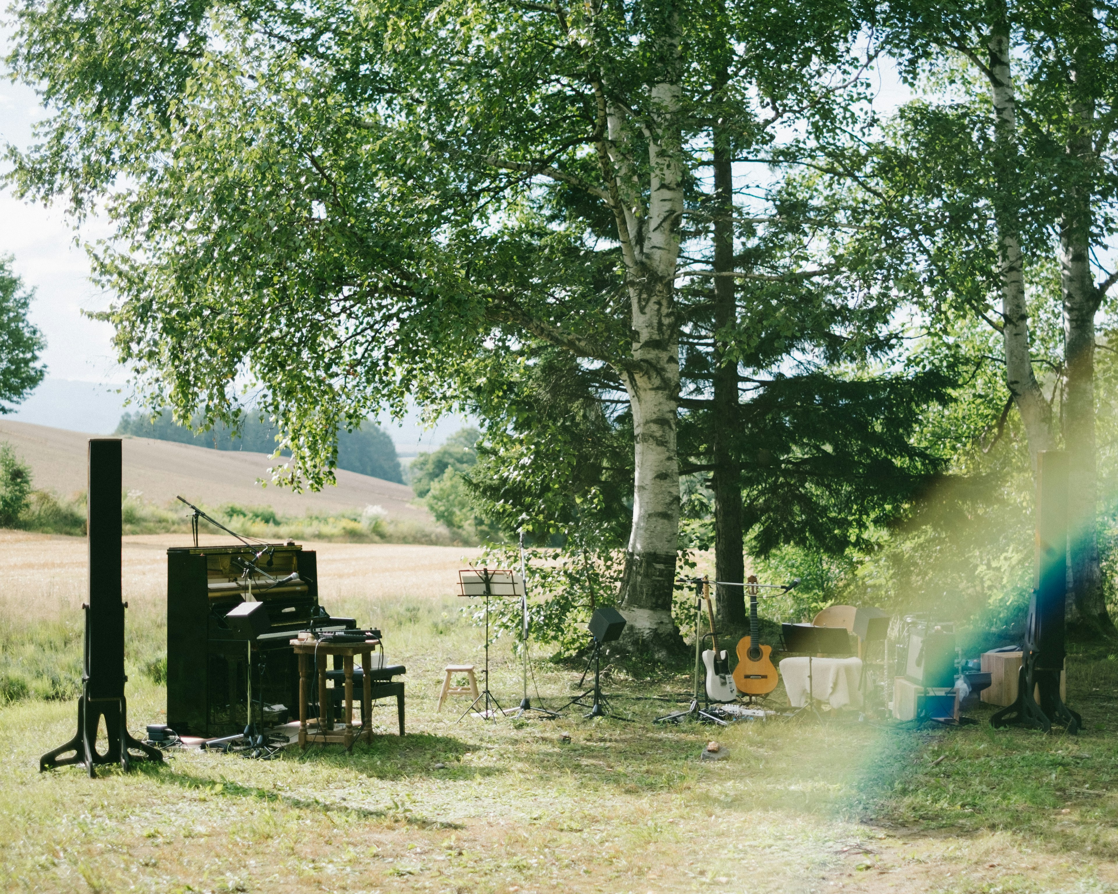 Setup of musical instruments and equipment in a natural setting