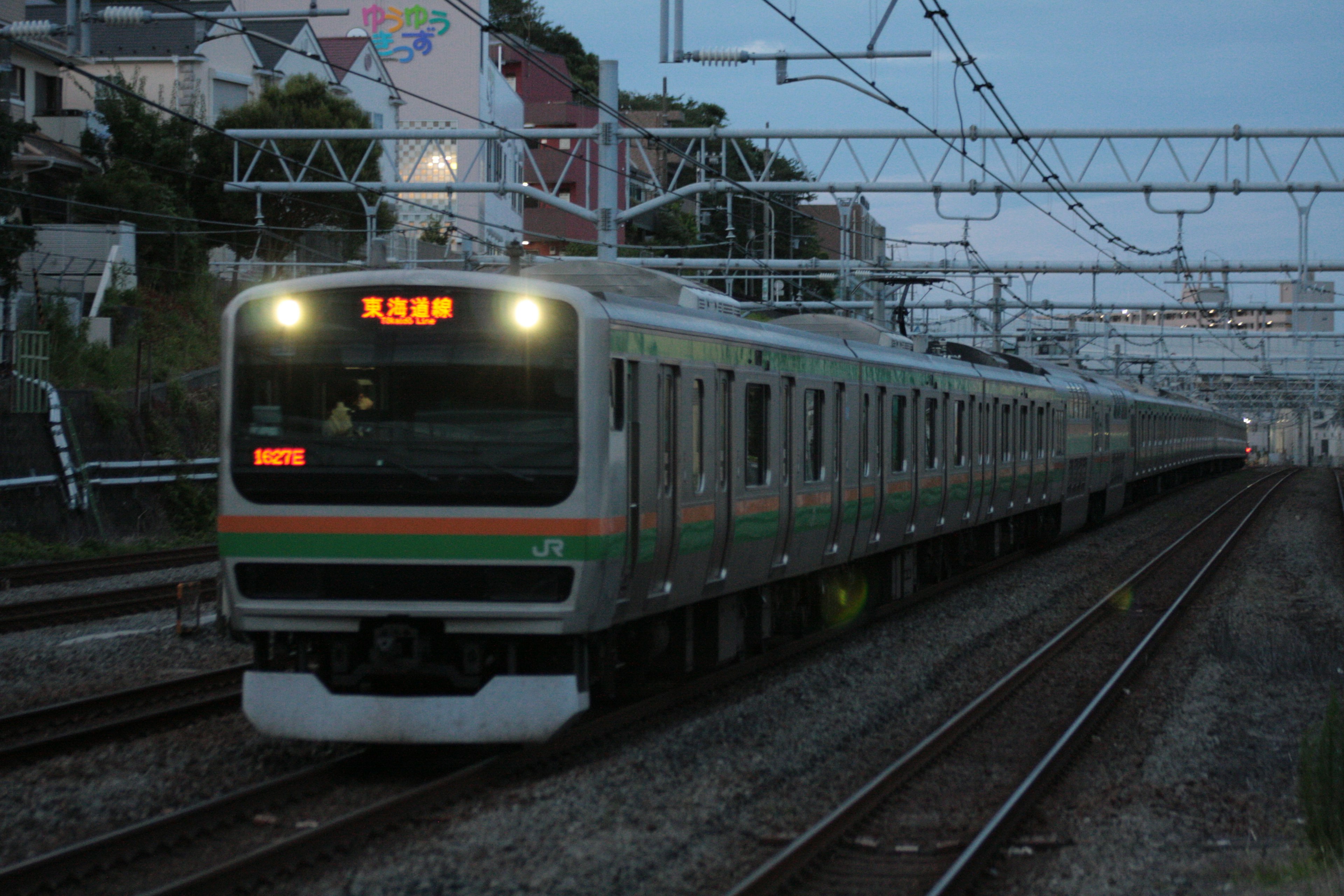 Train running on tracks during dusk