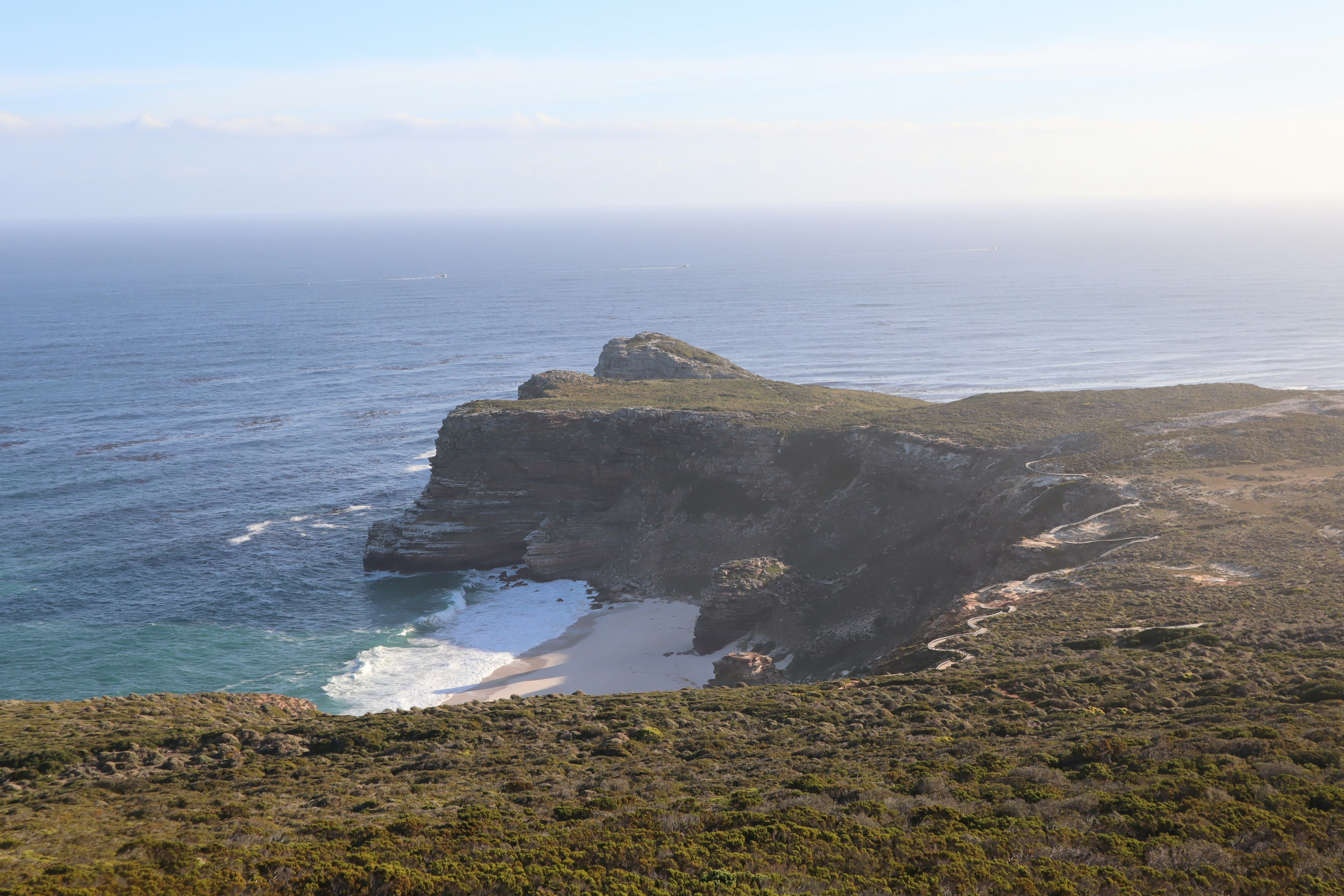 Scenic view of coastline and rocky cliffs overlooking the ocean