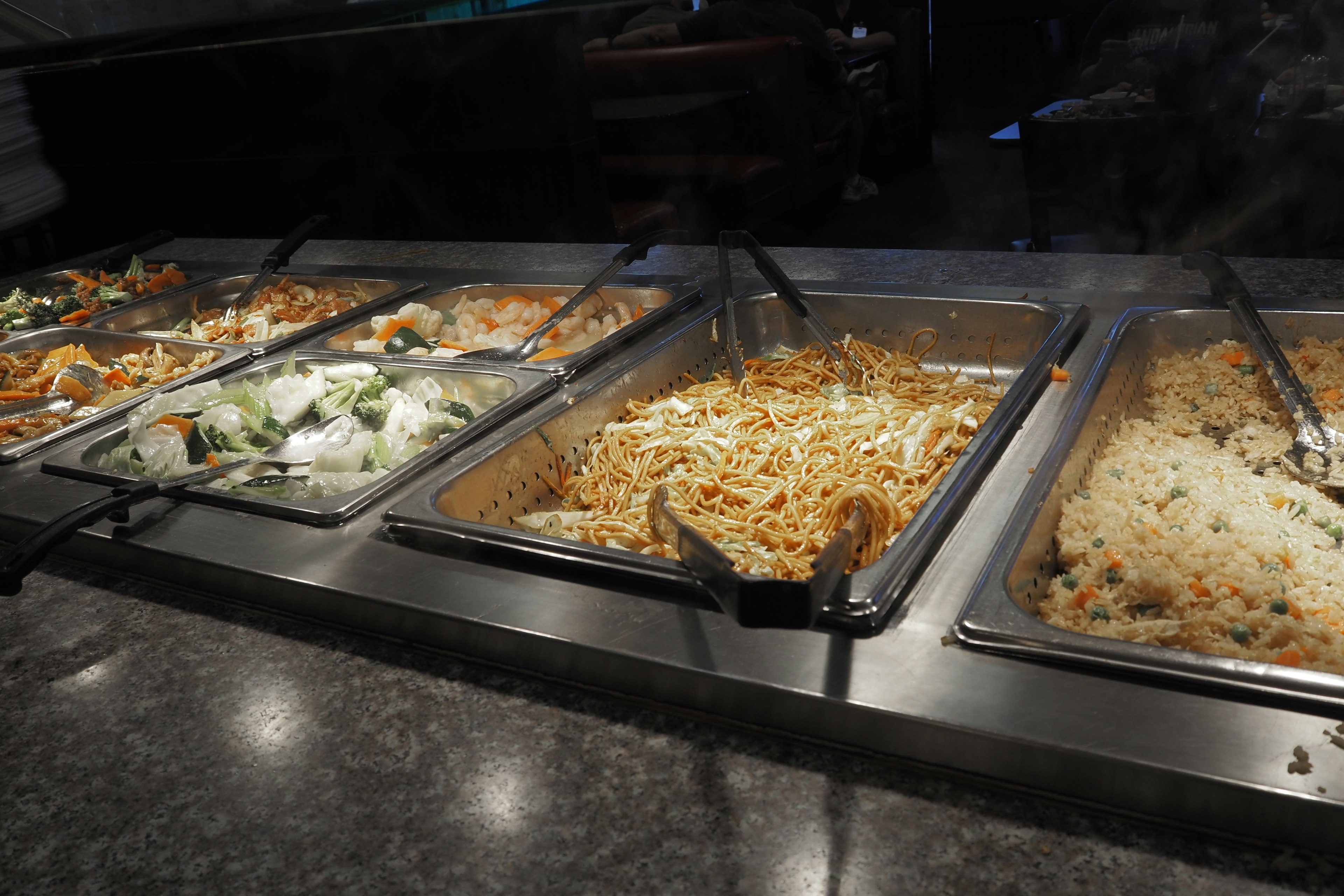 Buffet style food display with various dishes