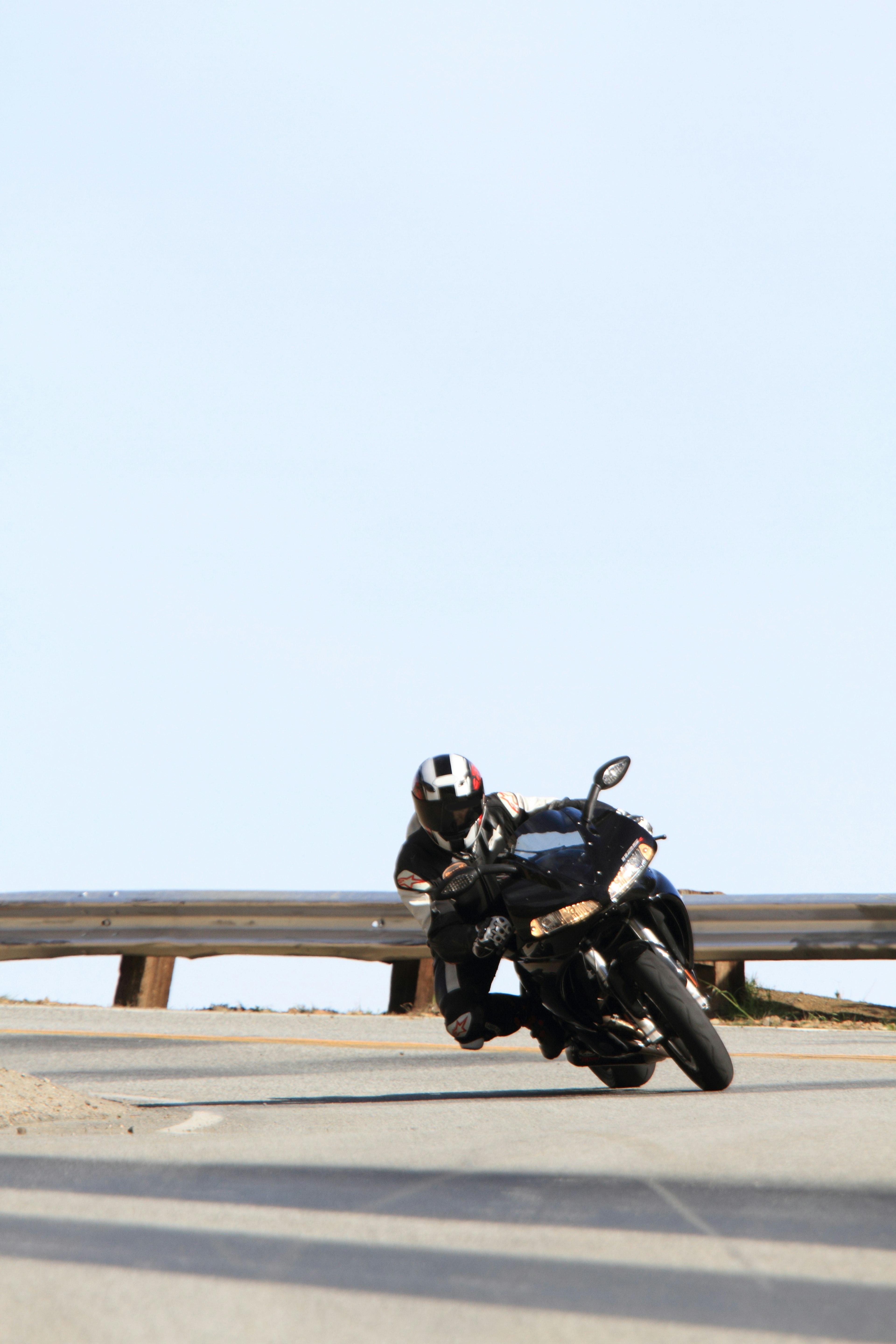 A rider leaning into a curve on a motorcycle