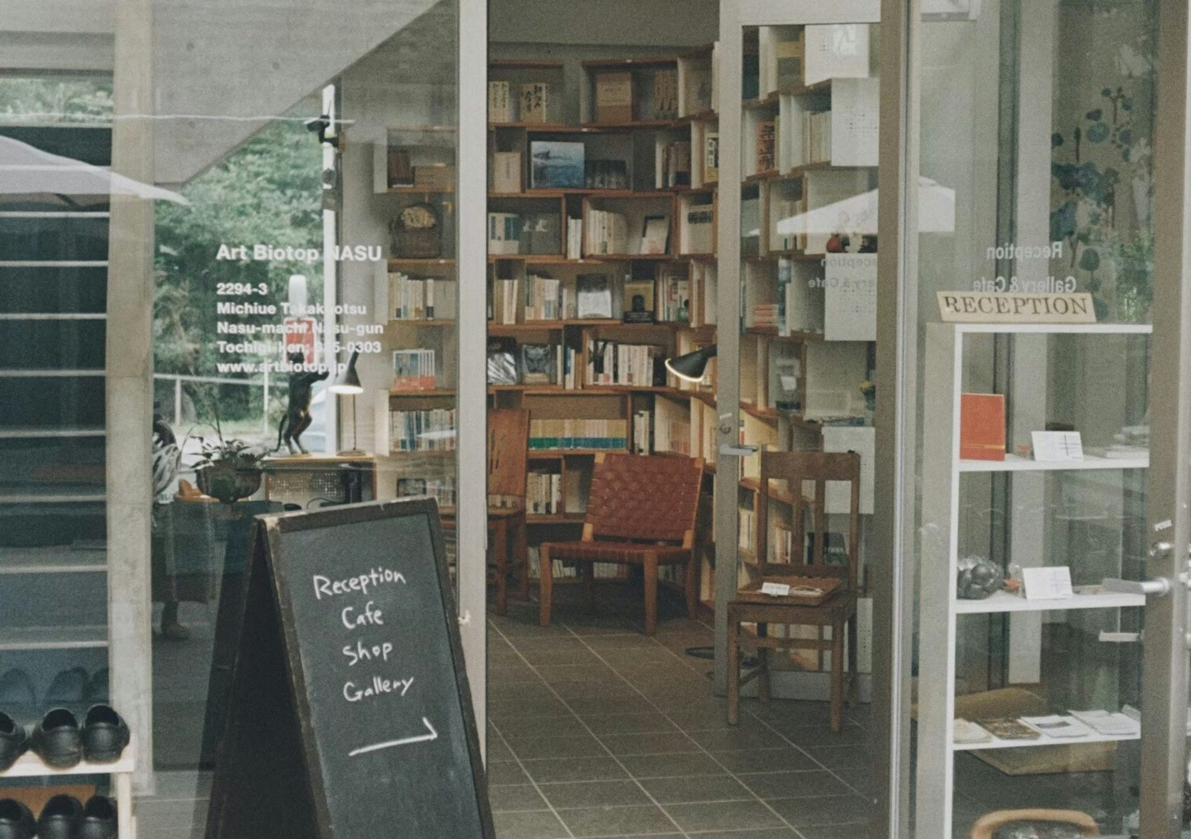 Cozy space featuring a bookstore and café with bookshelves and chairs visible