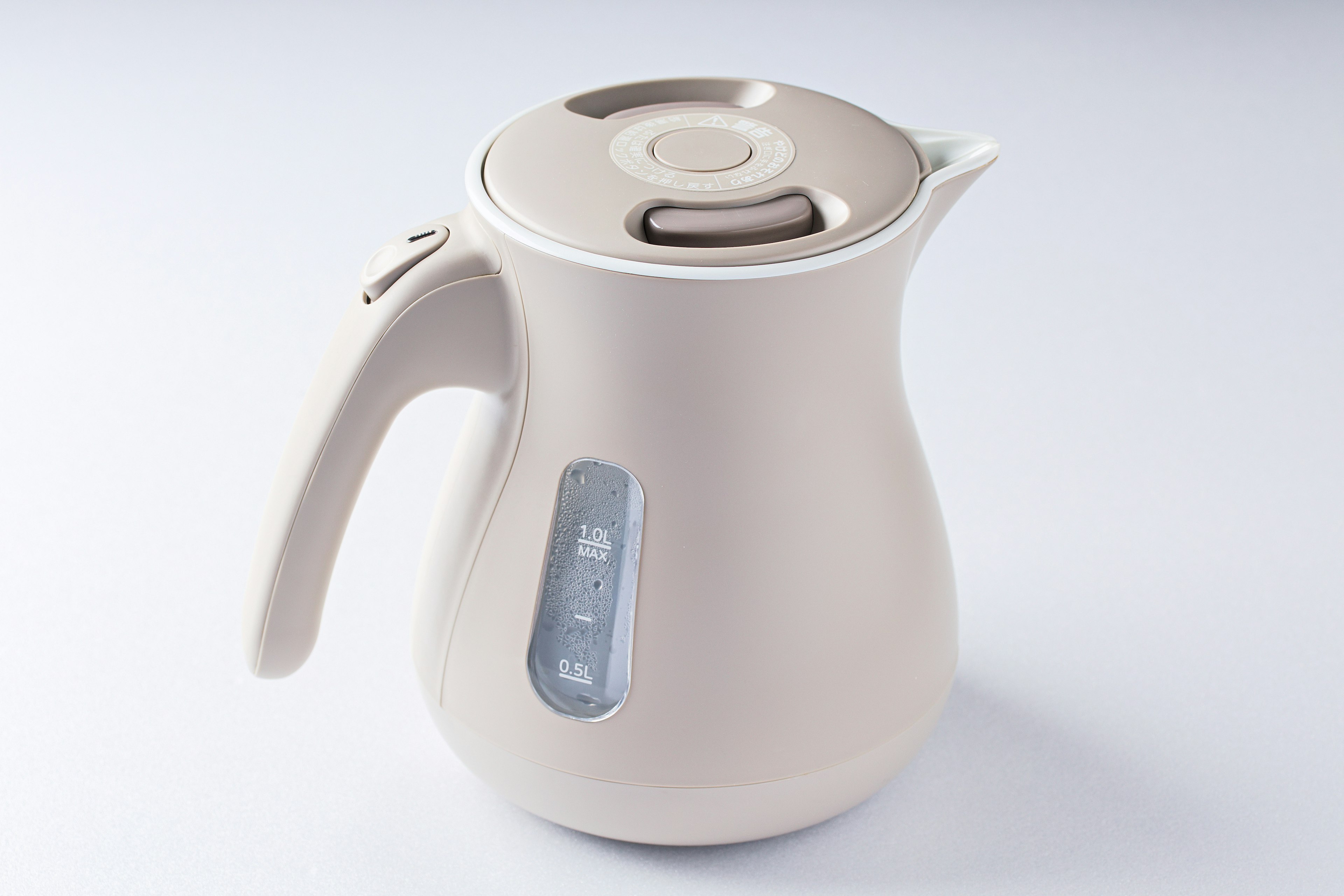 Modern beige electric kettle with a side water level indicator