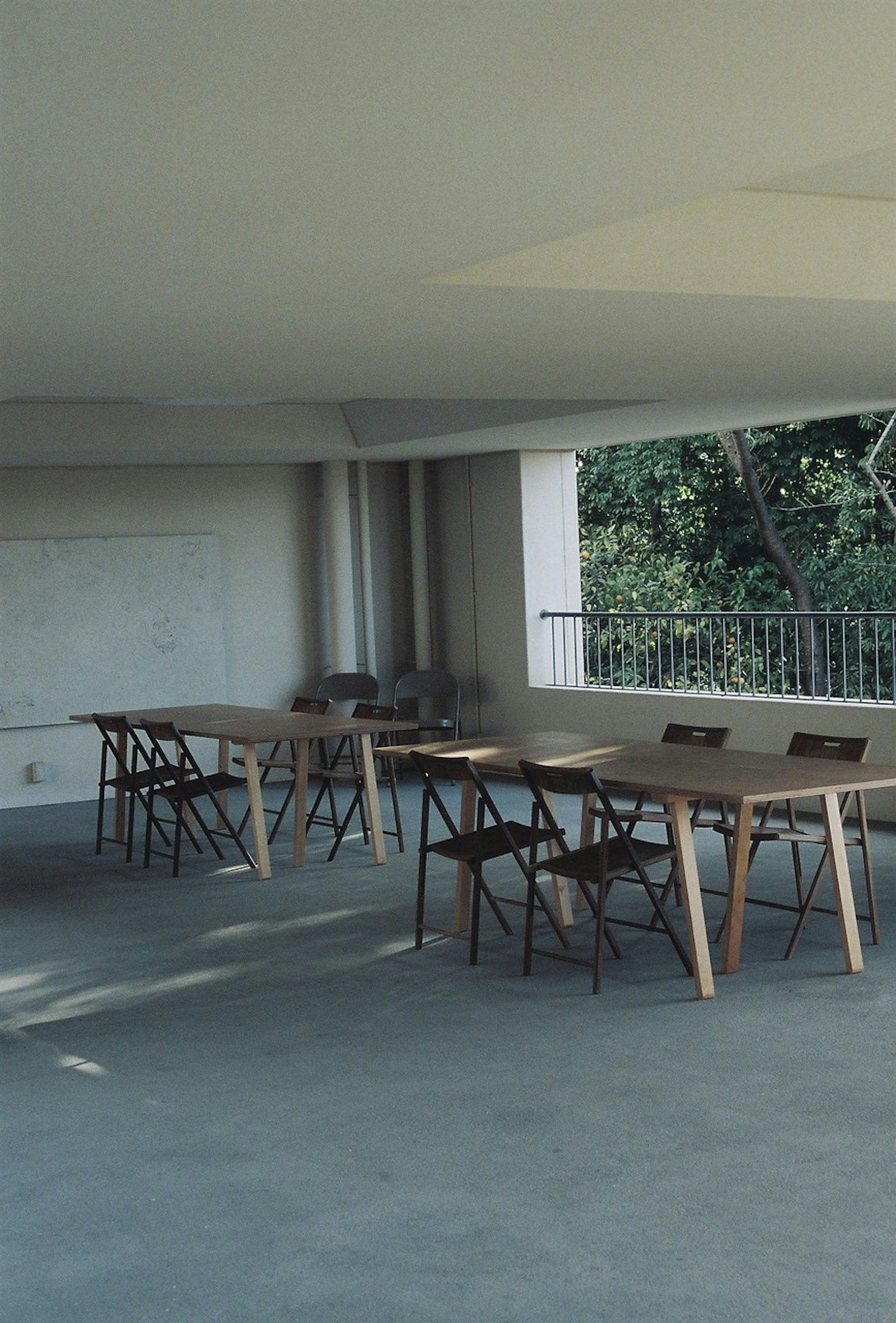 Bright indoor space with tables and chairs arranged