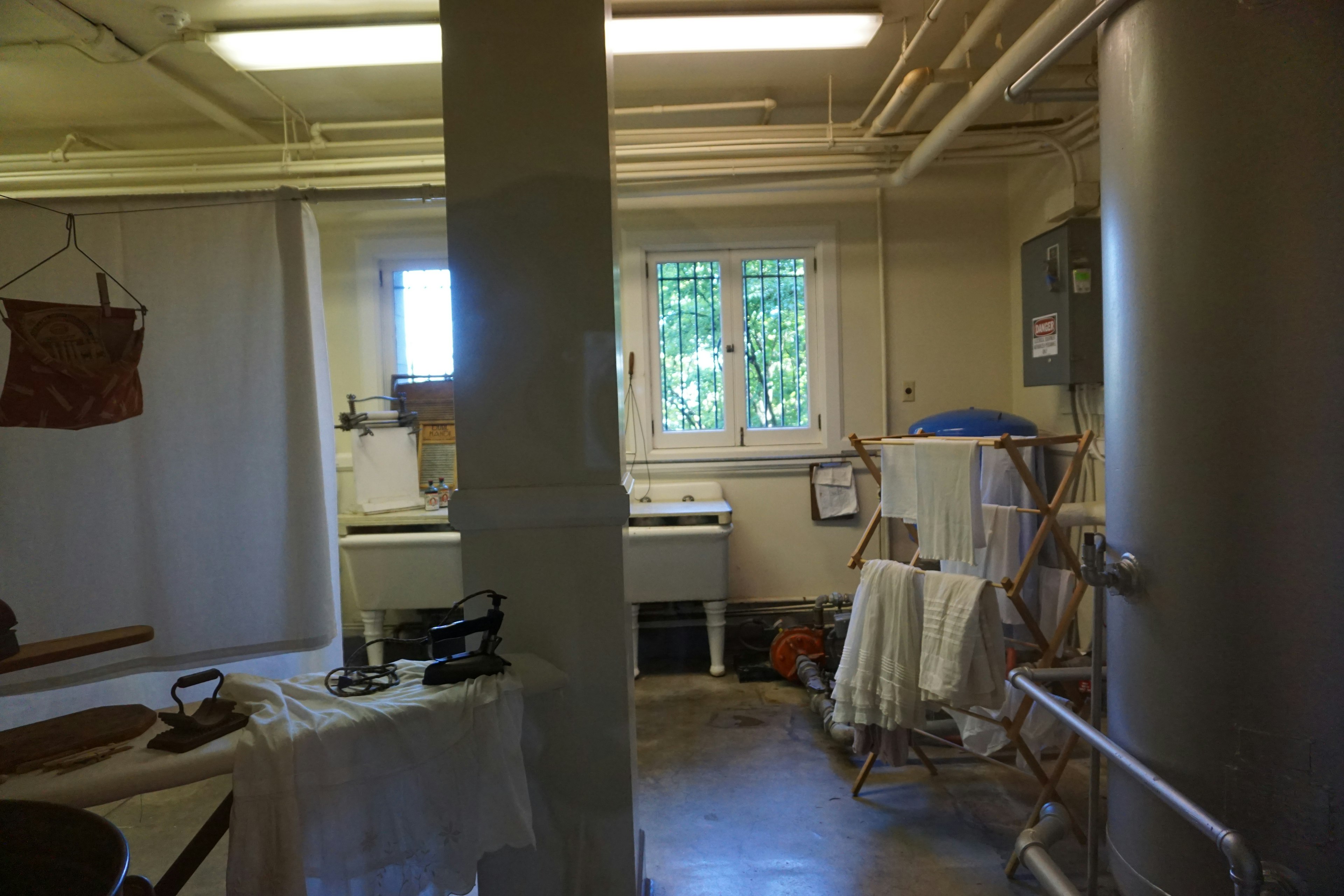 Bright interior of a workspace featuring a washing machine and dryer