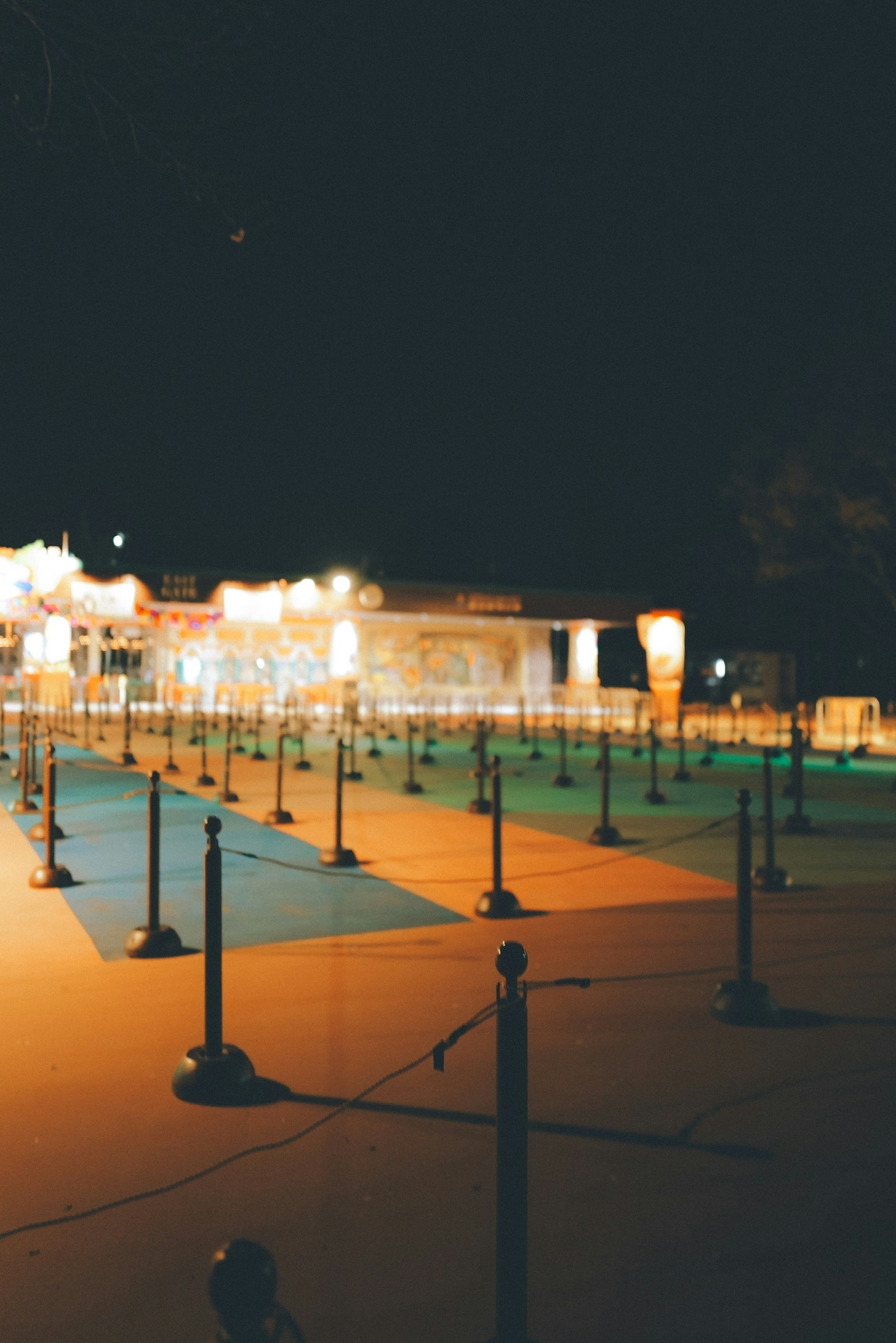 Colorful floor and lights of an amusement park at night