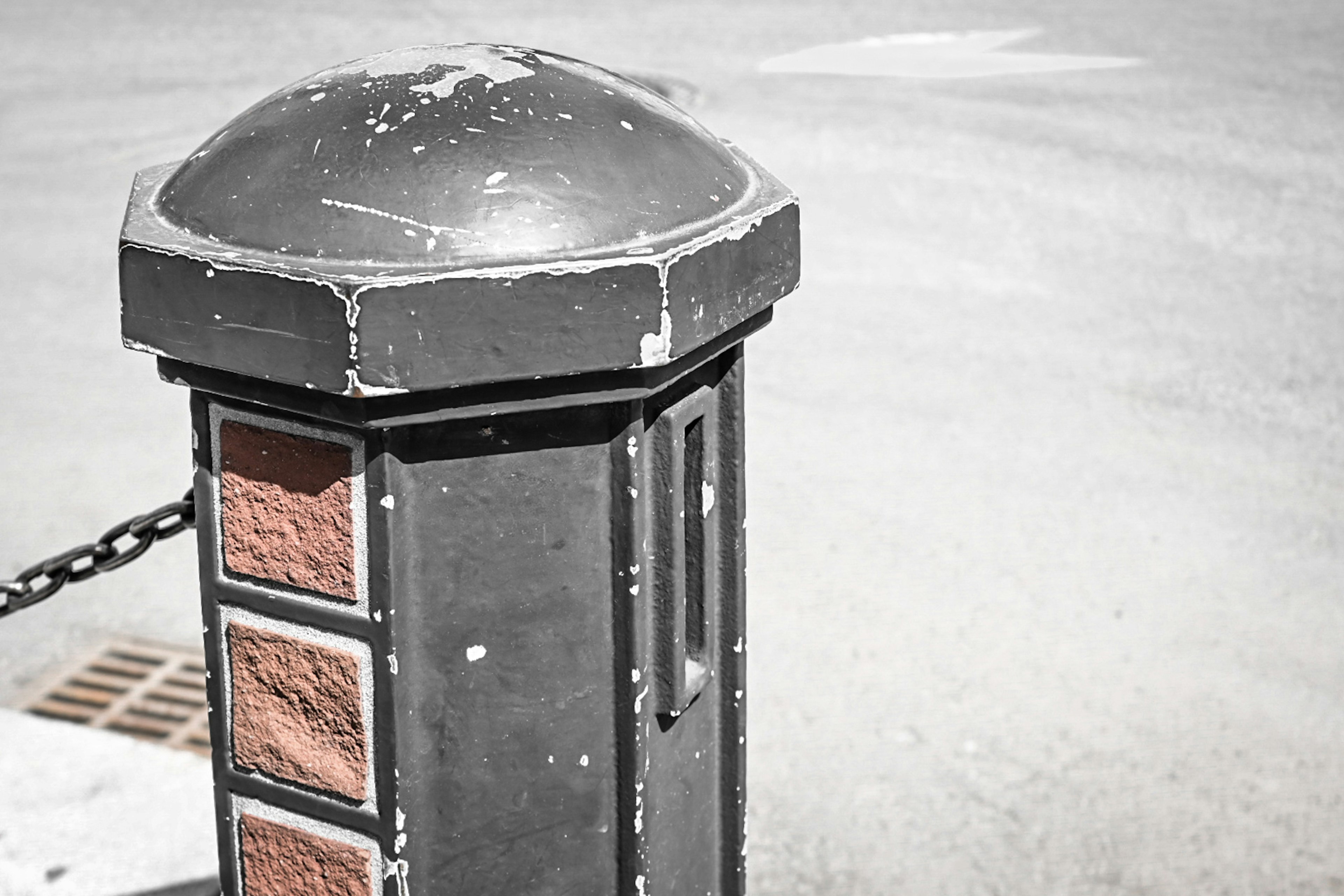 Black post with a domed top featuring square orange panels