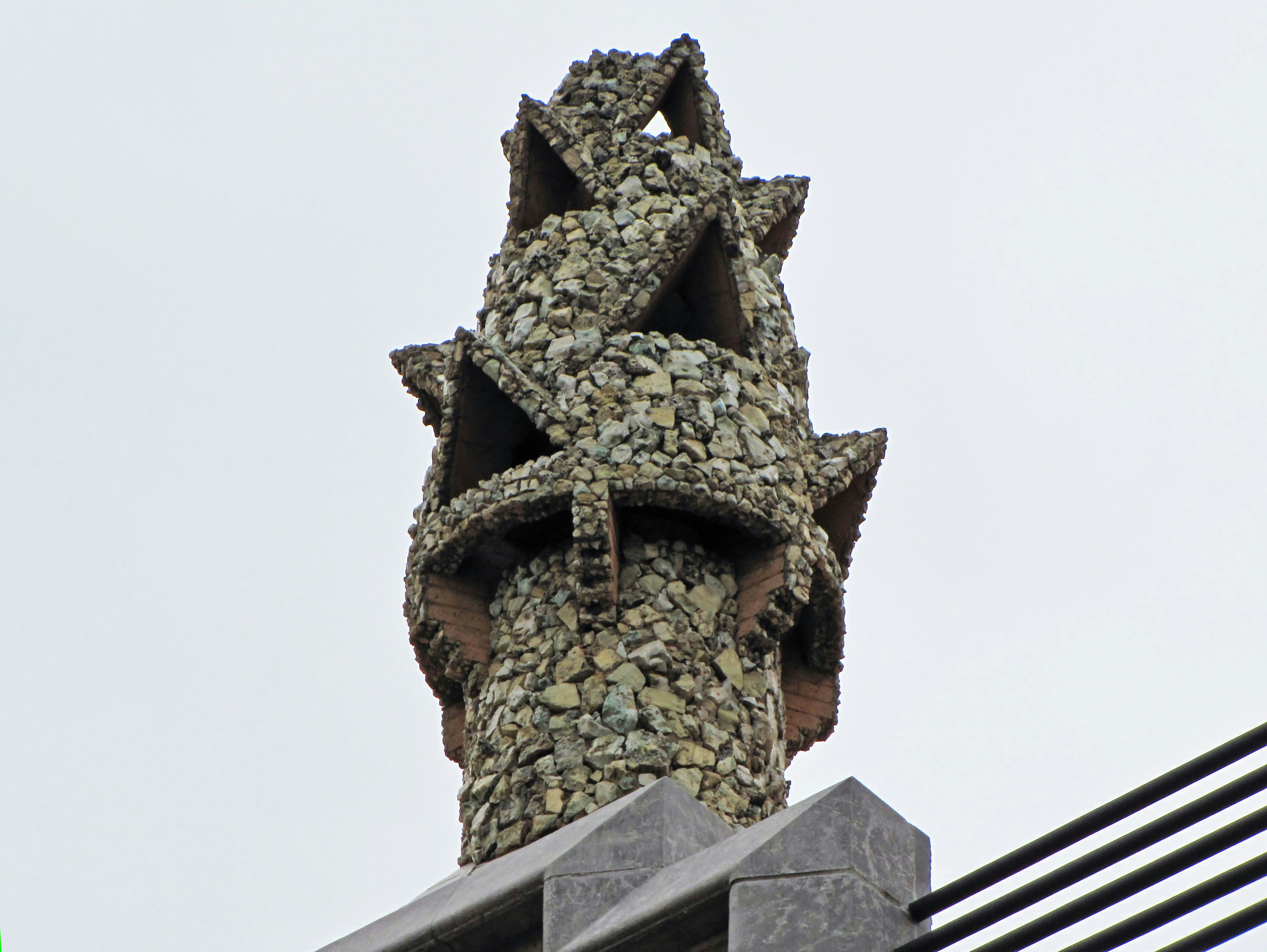 Unique stone-designed chimney top with intricate details