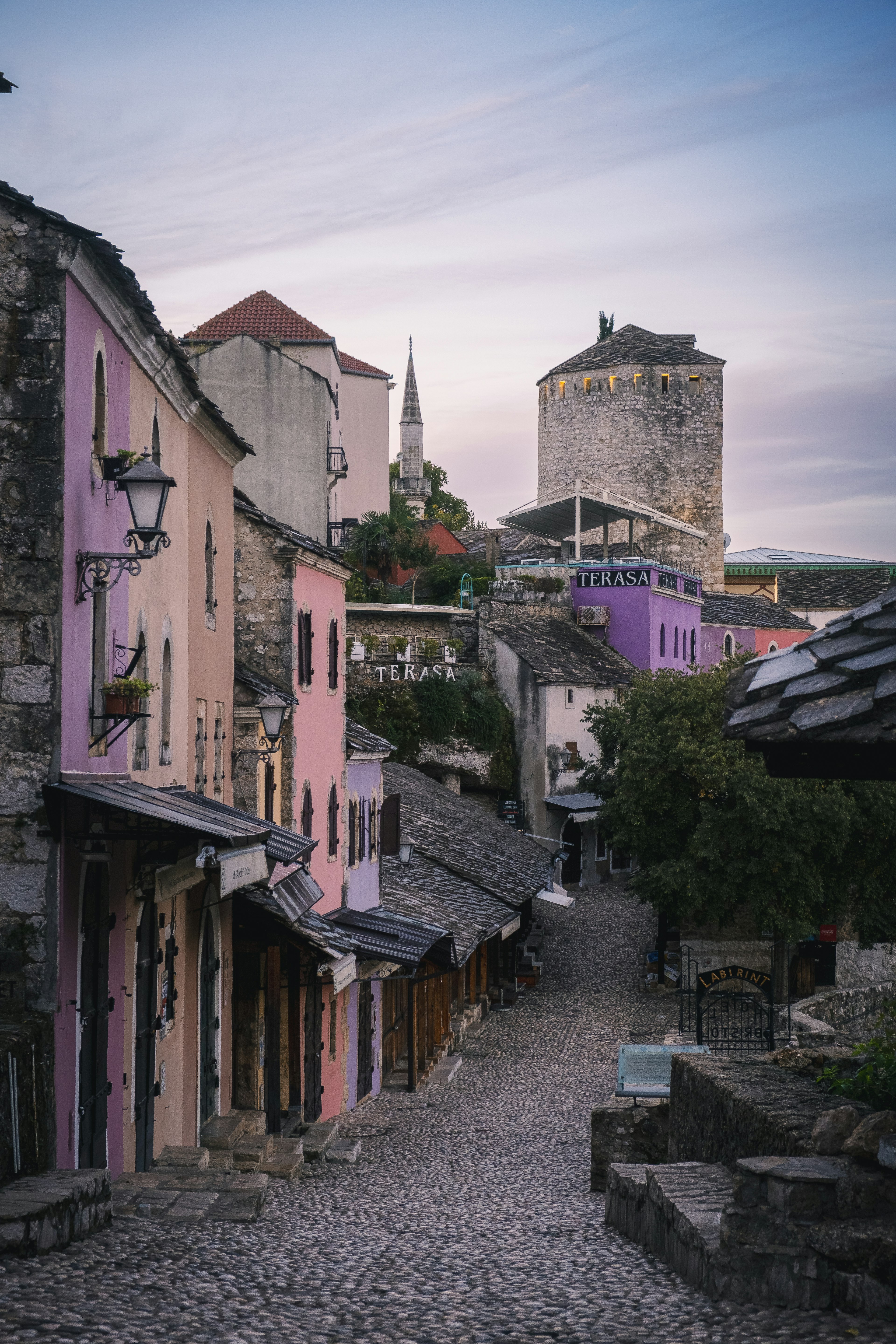 Colorful buildings along a cobblestone street