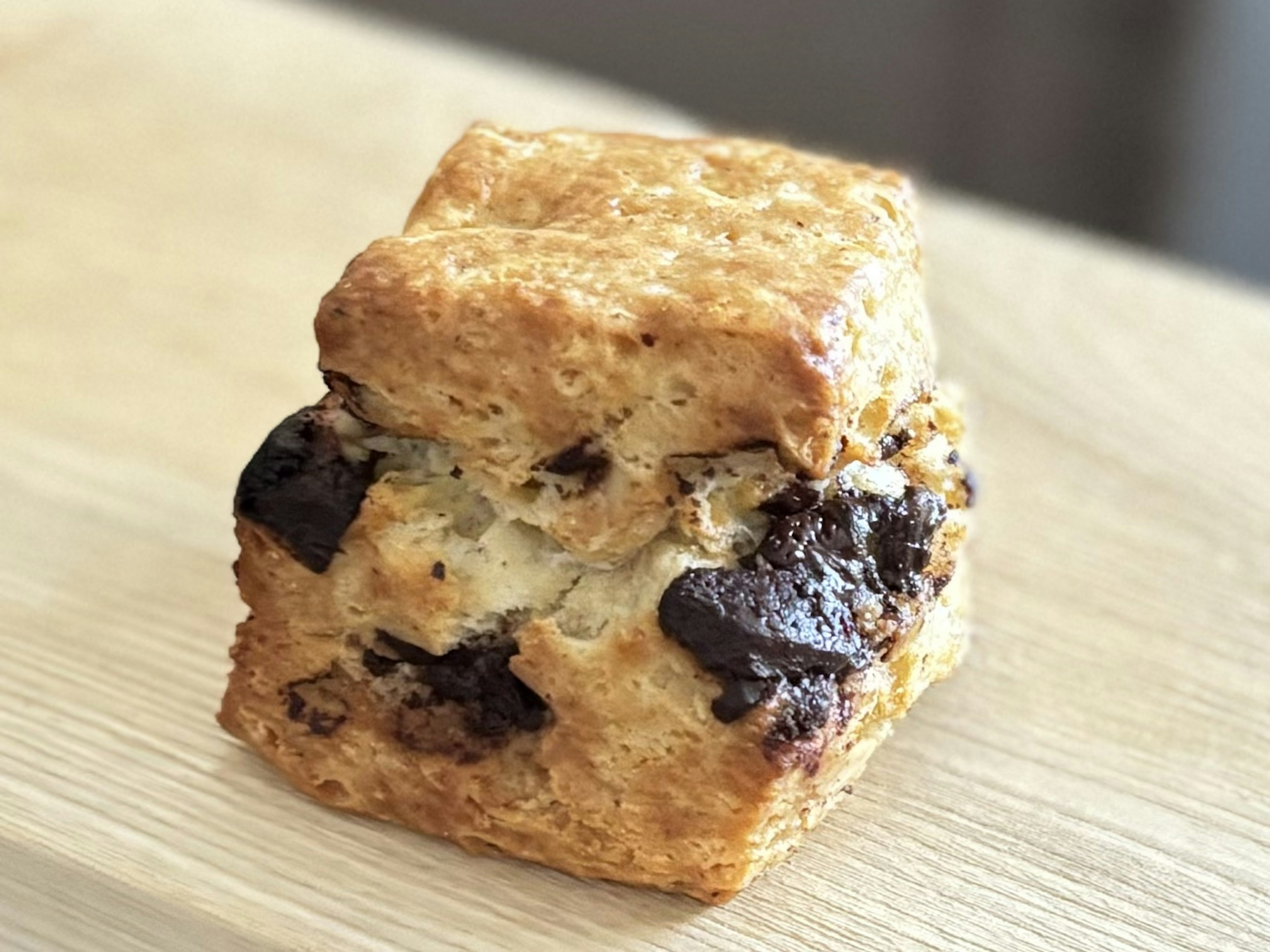 Freshly baked chocolate biscuit placed on a wooden table