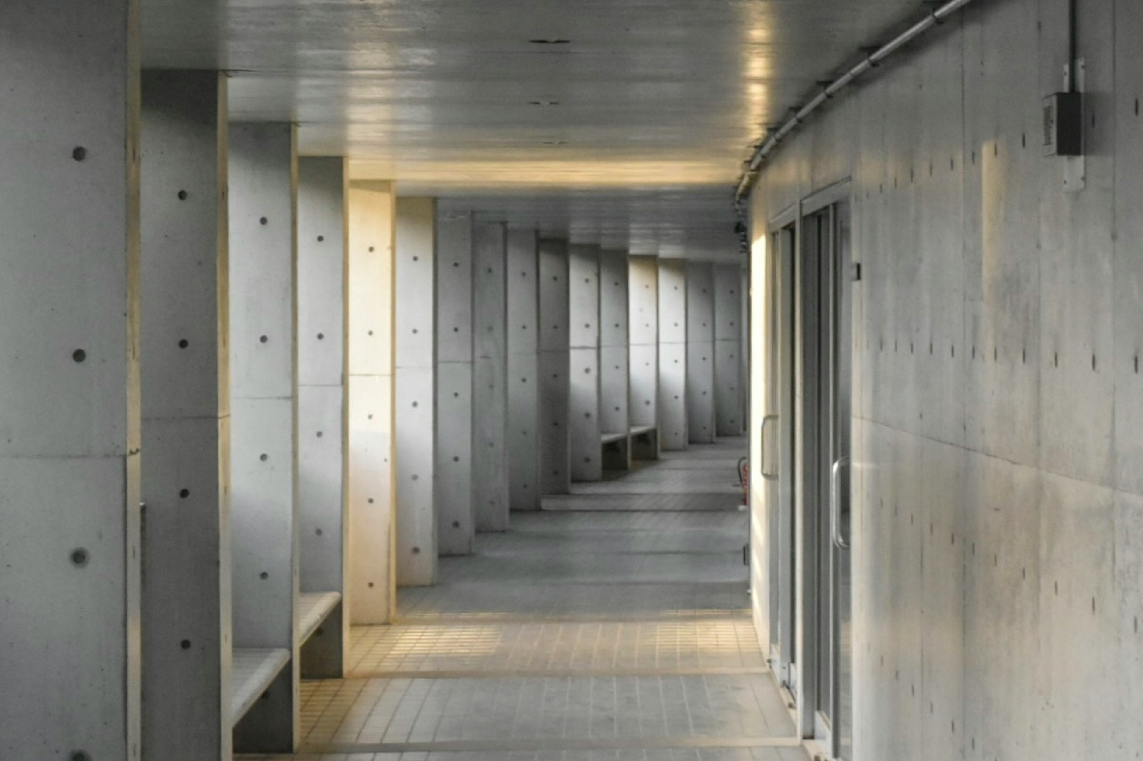 Long corridor with concrete walls and modern architectural design