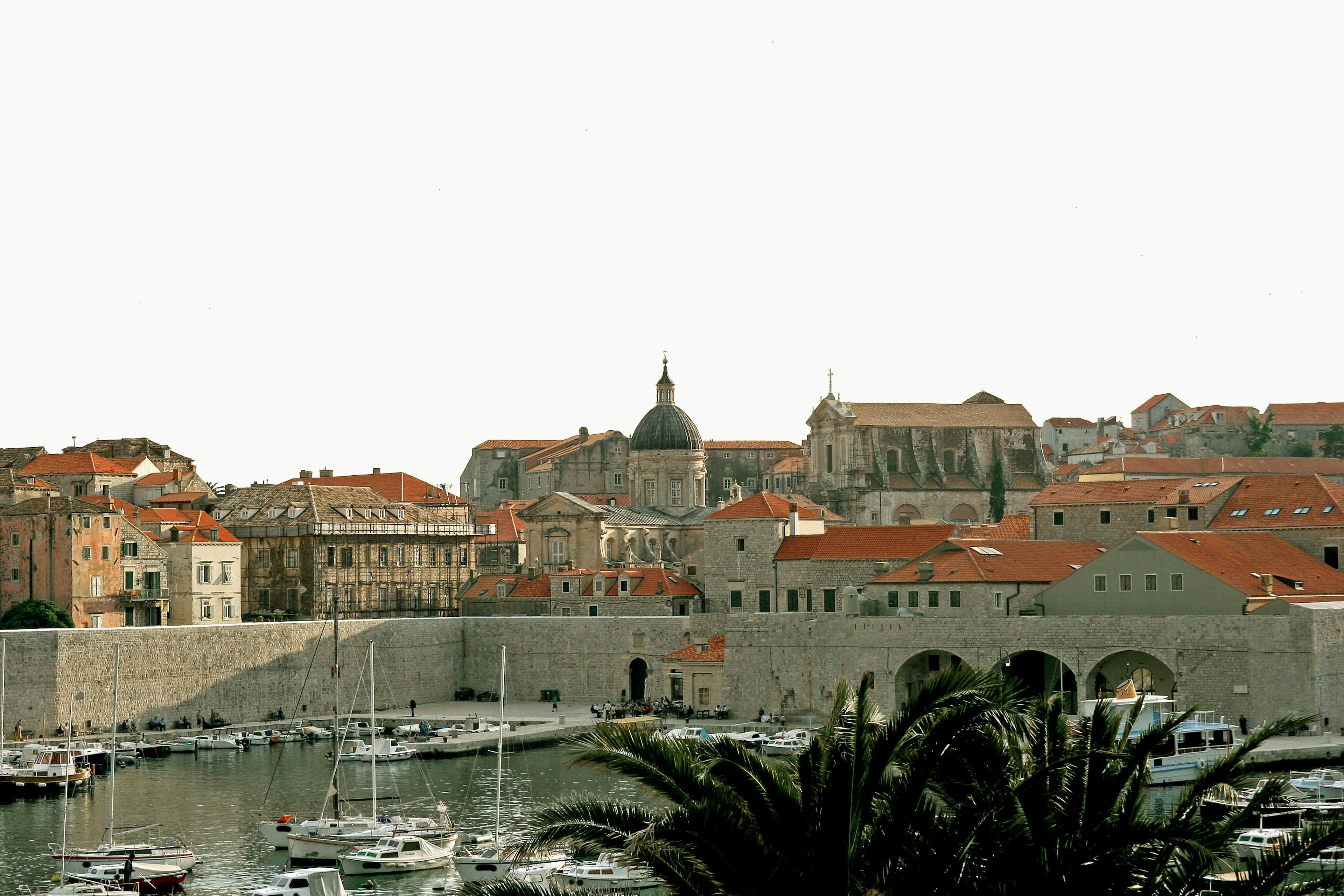 Historic buildings with red roofs overlooking the harbor in Dubrovnik