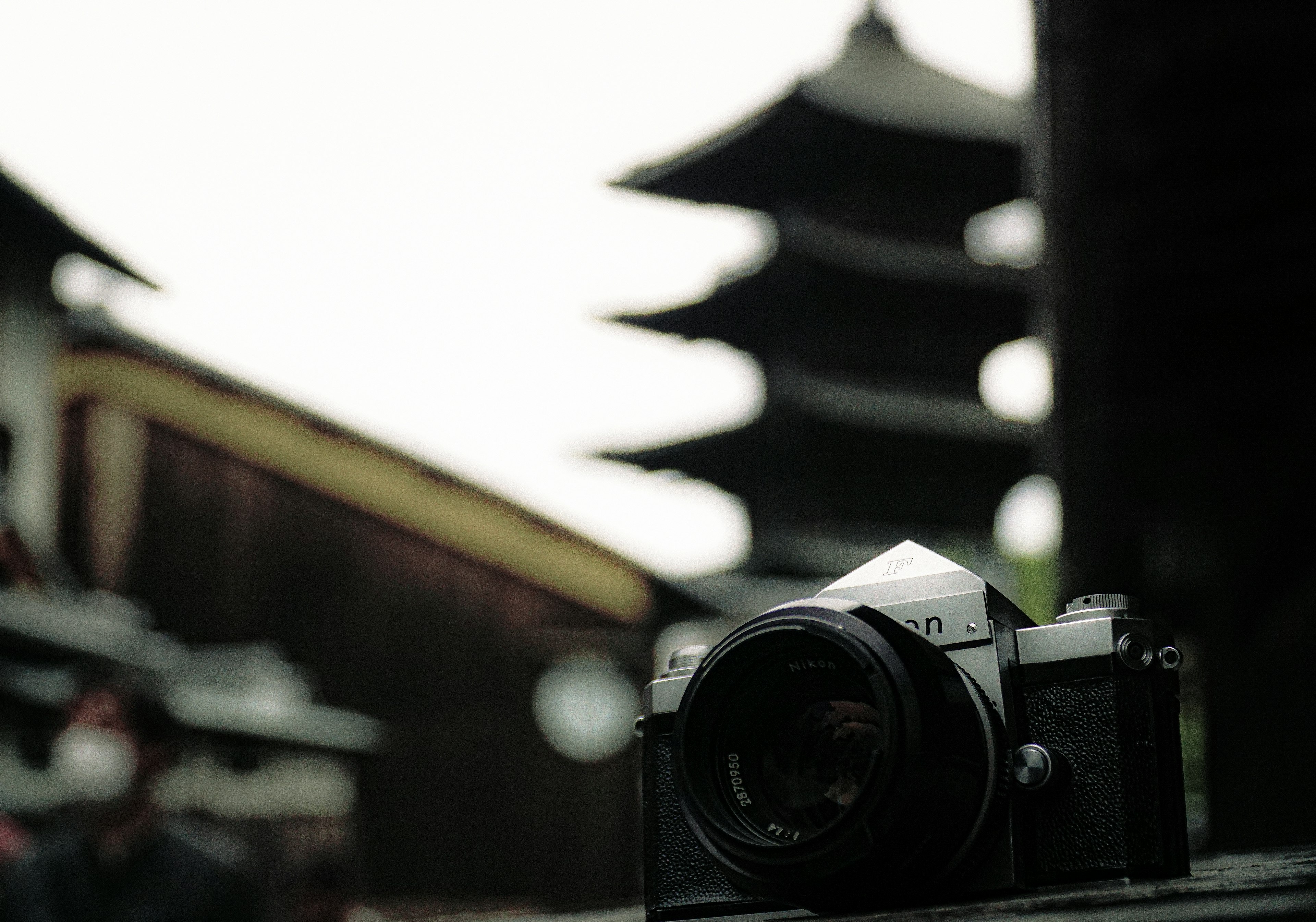 Camera with a traditional Japanese pagoda in the background