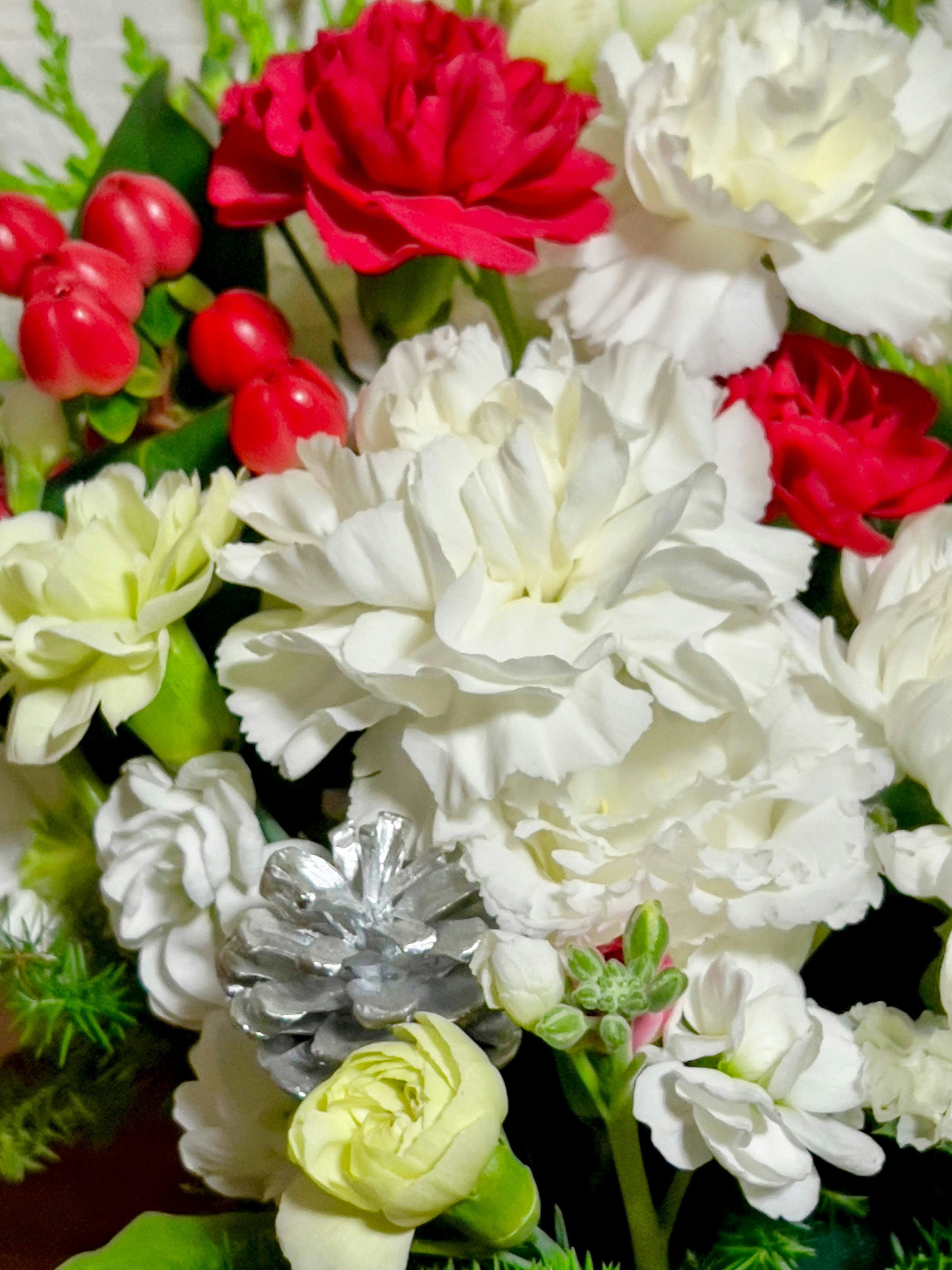 A vibrant bouquet featuring red and white flowers