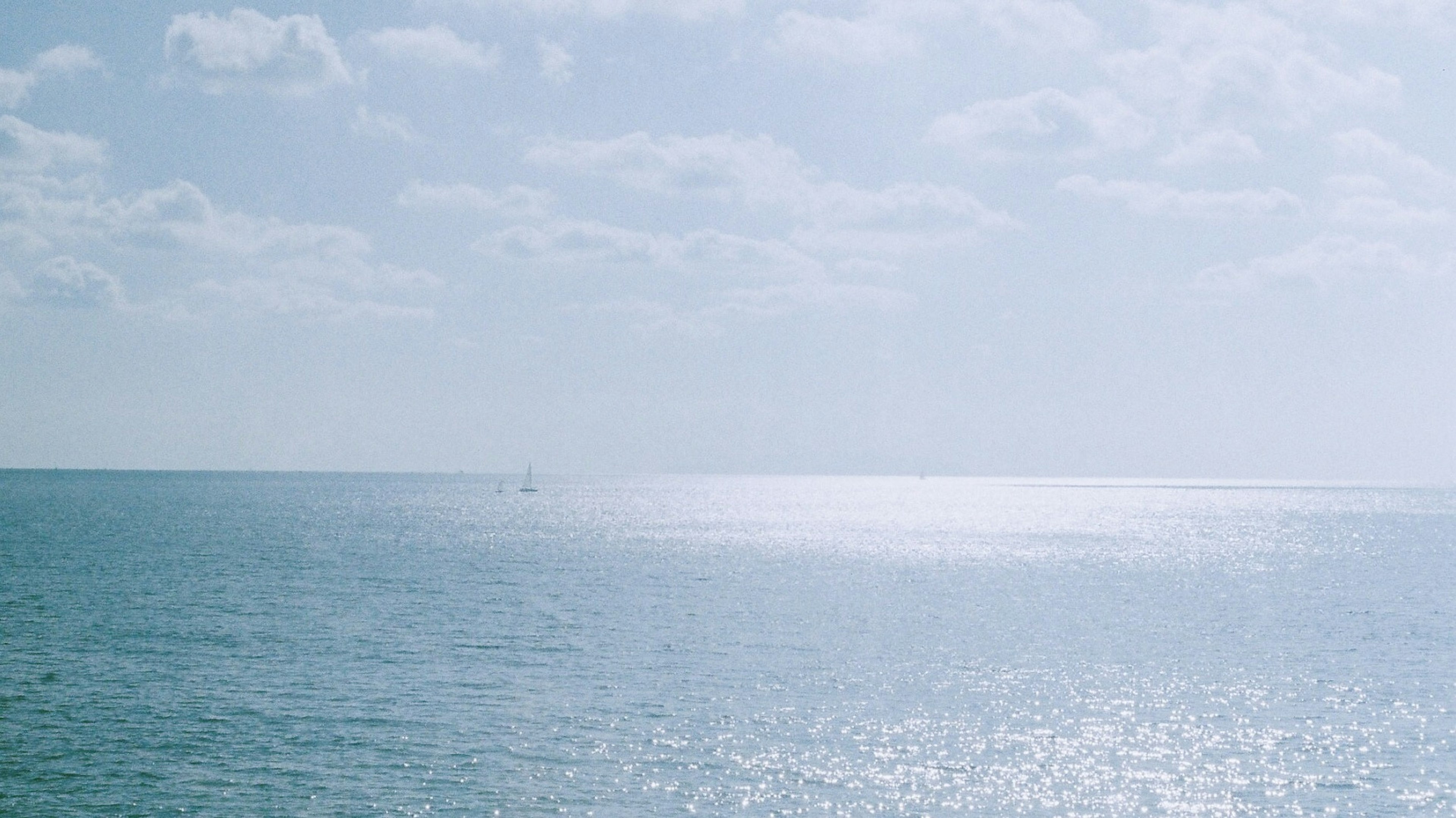 Serene ocean view with a bright sky