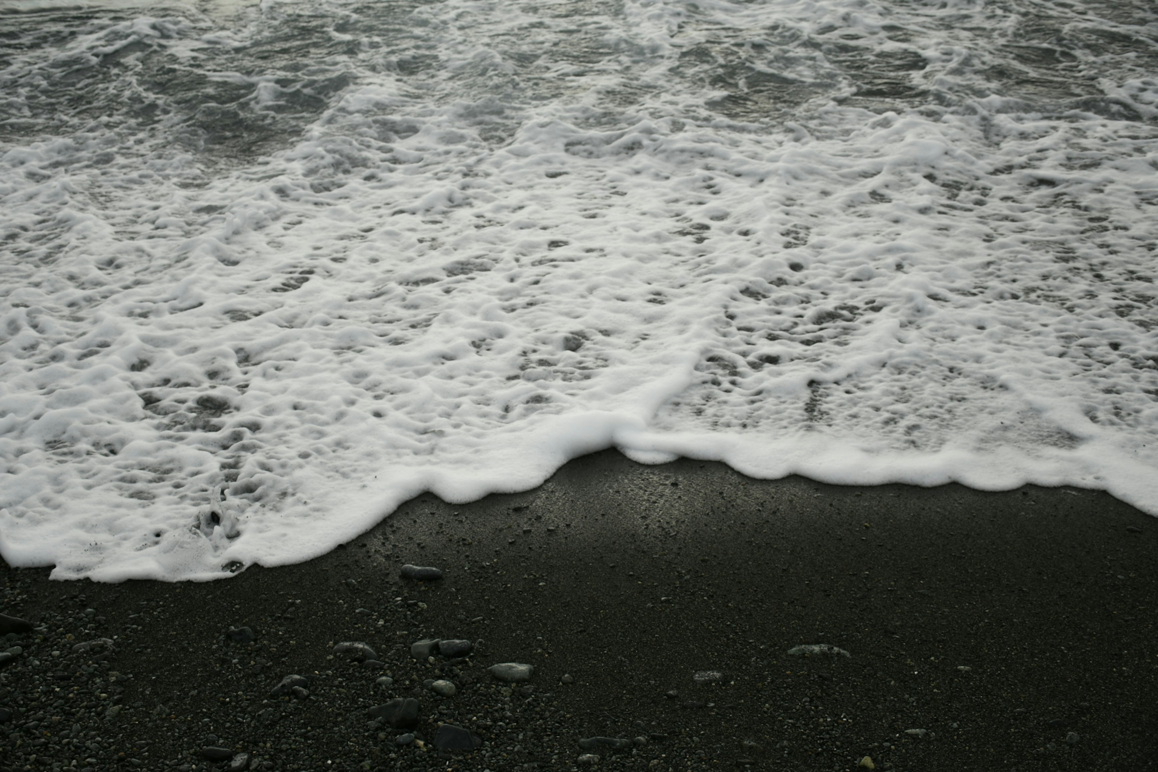 Waves crashing on a sandy beach