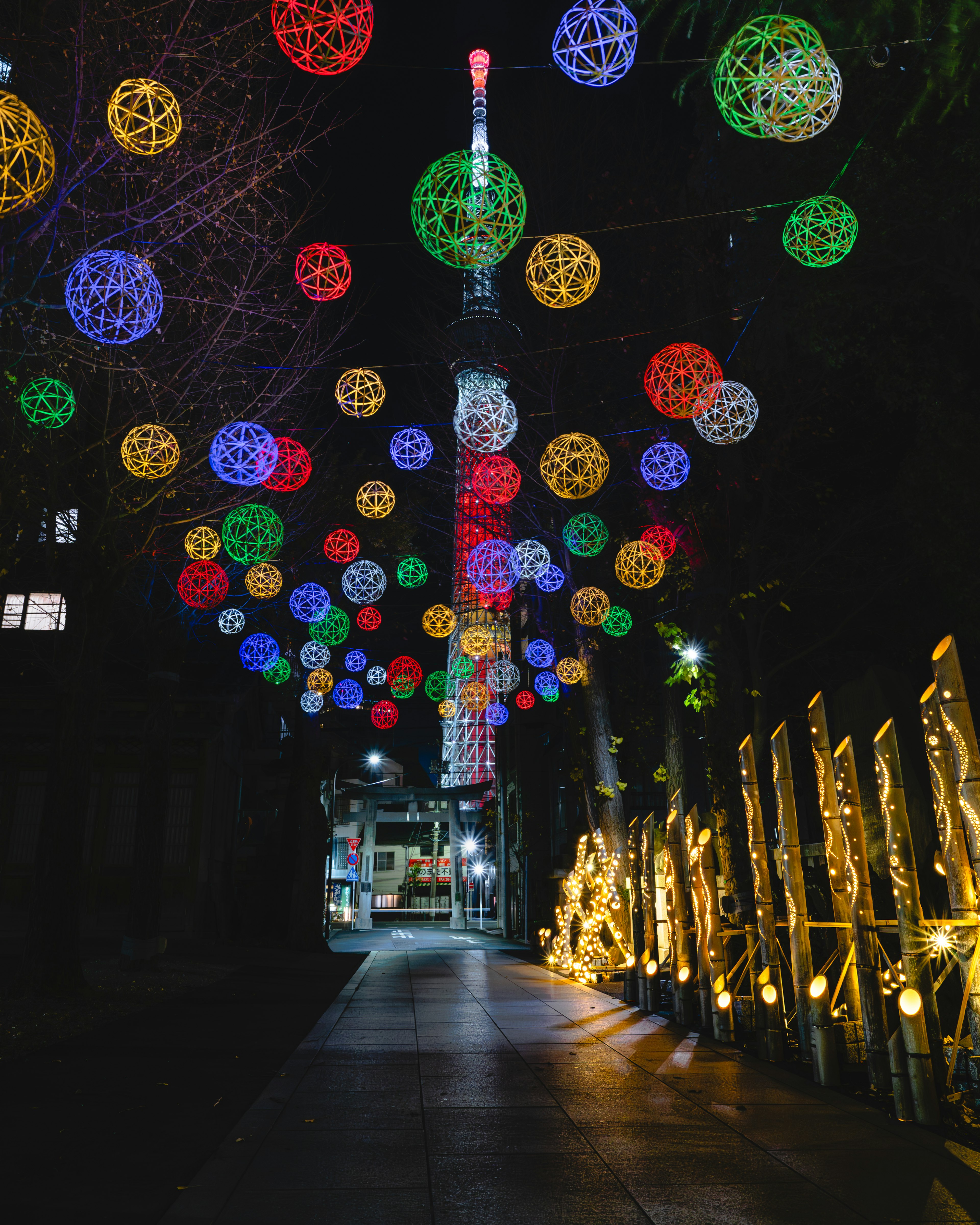 Night view of Tokyo Skytree with colorful light decorations in the street