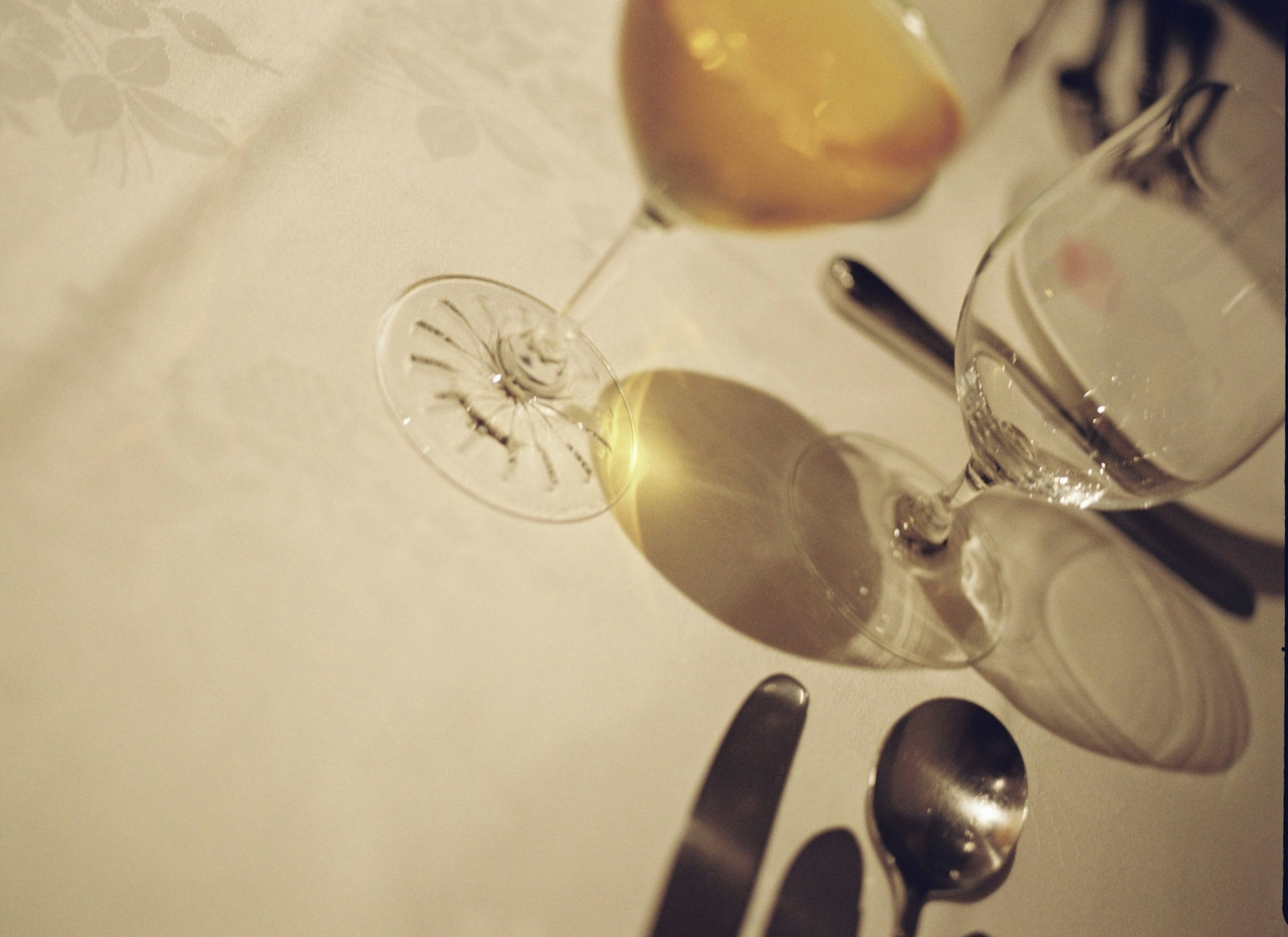 Set of glasses and cutlery on a dining table